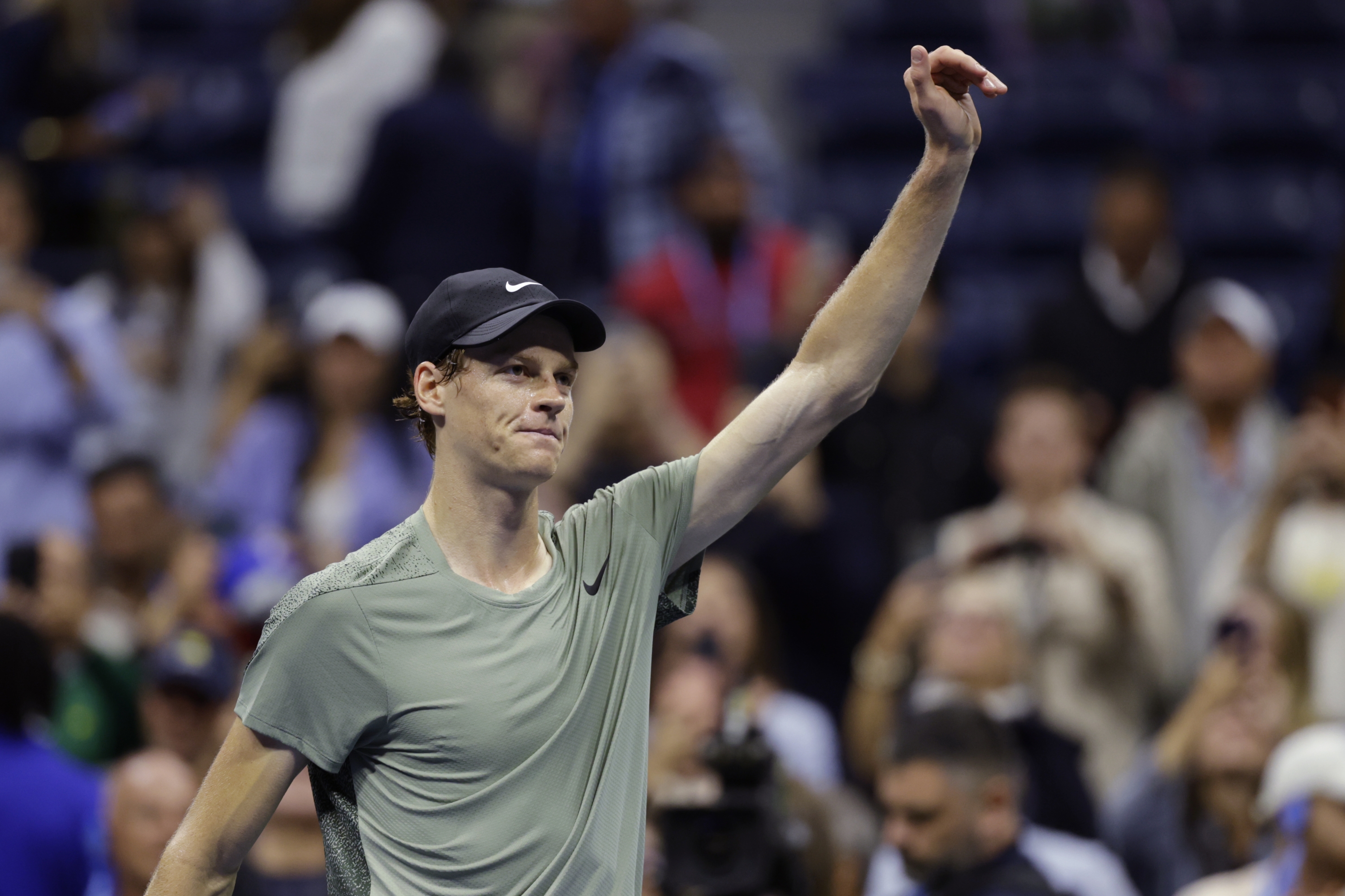 Jannik Sinner, of Italy, acknowledges the crowd after defeating Daniil Medvedev, of Russia, during the quarterfinals of the U.S. Open tennis championships, Wednesday, Sept. 4, 2024, in New York. (AP Photo/Adam Hunger)