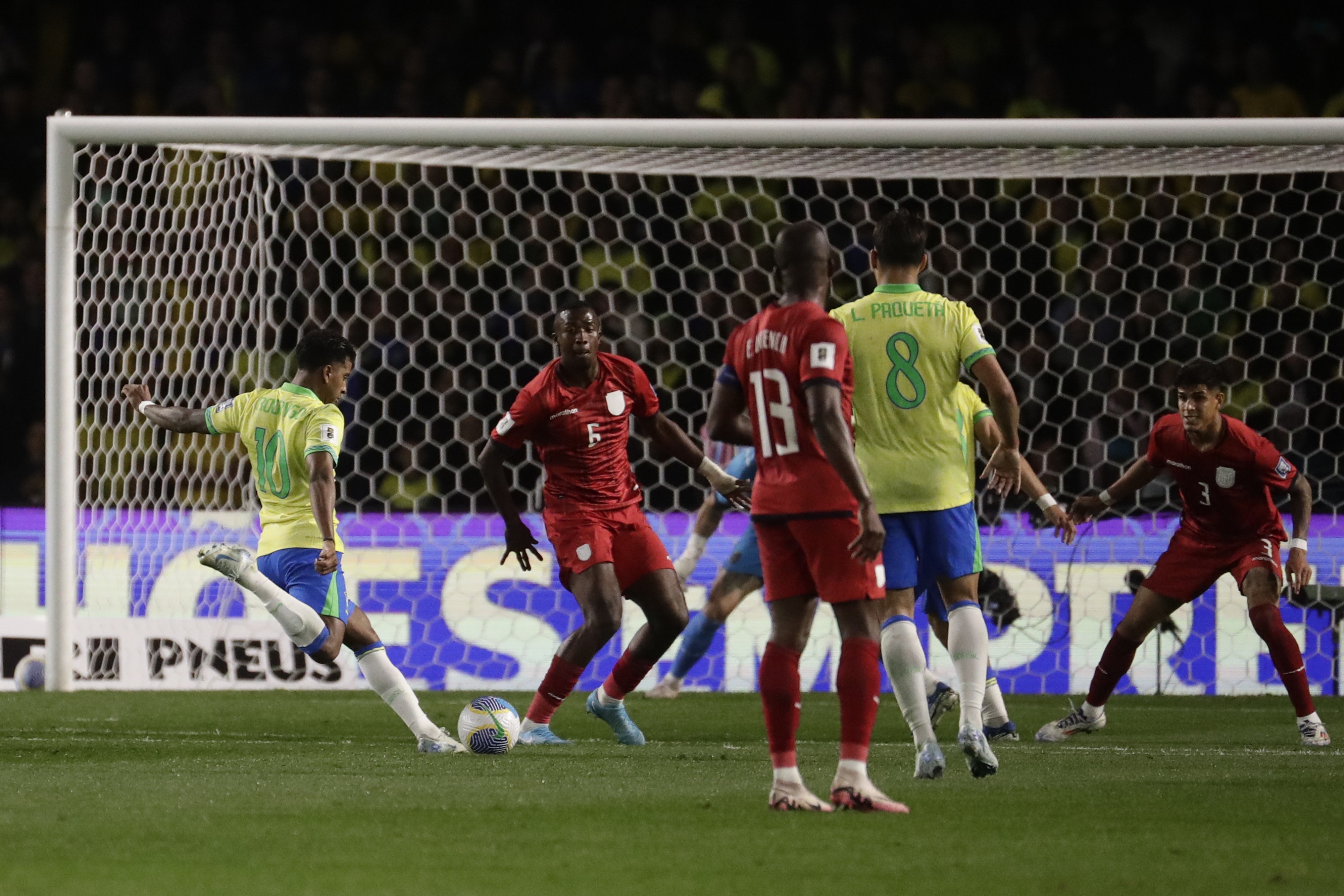 Brazil's Rodrygo, left, scores the opening goal against Ecuador during a qualifying soccer match for the FIFA World Cup 2026 at Couto Pereira Stadium in Curitiba, Parana state, Brazil, Friday, Sept. 6, 2024. (AP Photo/Bruna Prado)