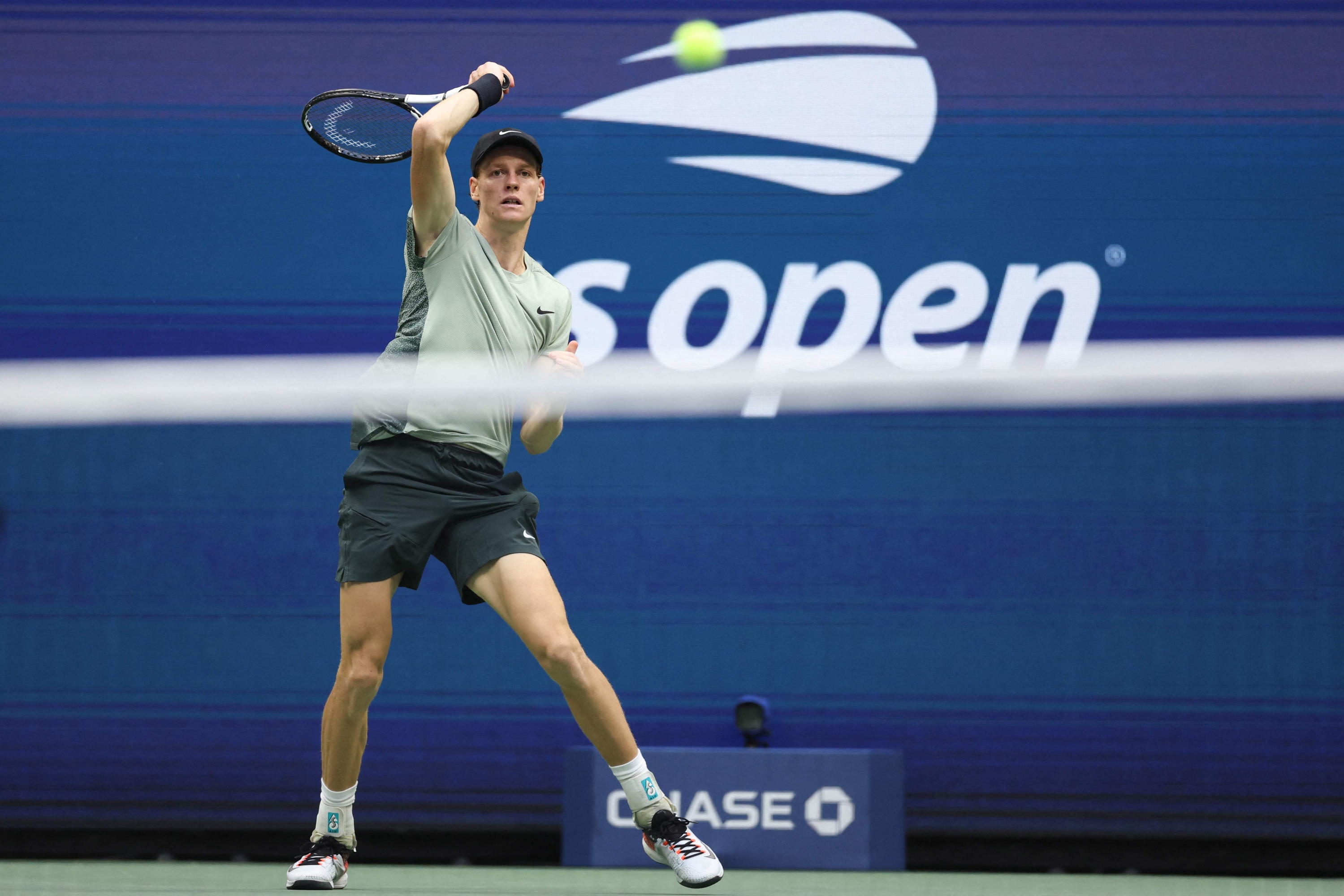 Italy's Jannik Sinner hits a return to Britain's Jack Draper during their men's semifinals match on day twelve of the US Open tennis tournament at the USTA Billie Jean King National Tennis Center in New York City, on September 6, 2024. (Photo by CHARLY TRIBALLEAU / AFP)