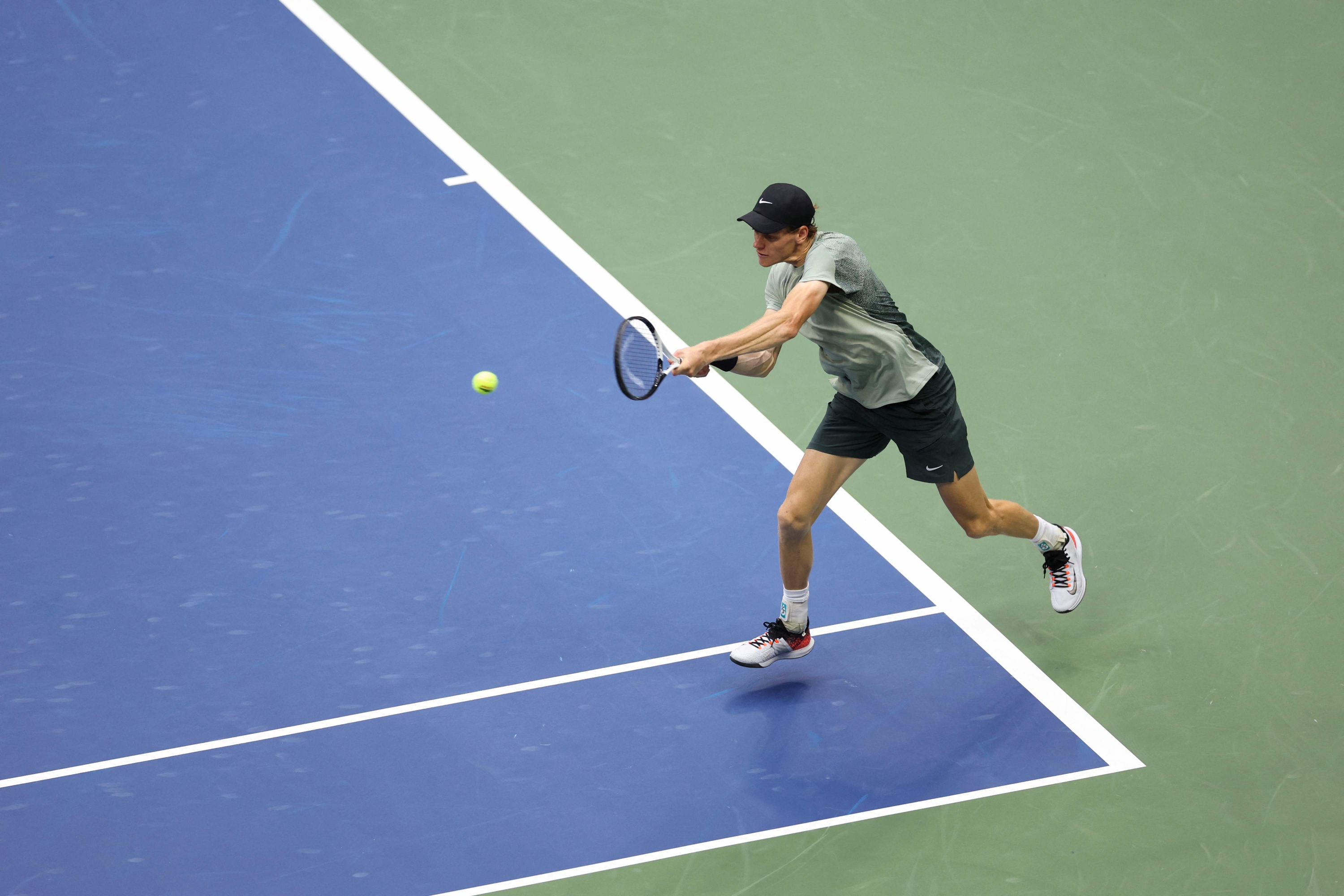 Italy's Jannik Sinner hits a return to Britain's Jack Draper during their men's semifinals match on day twelve of the US Open tennis tournament at the USTA Billie Jean King National Tennis Center in New York City, on September 6, 2024. (Photo by CHARLY TRIBALLEAU / AFP)