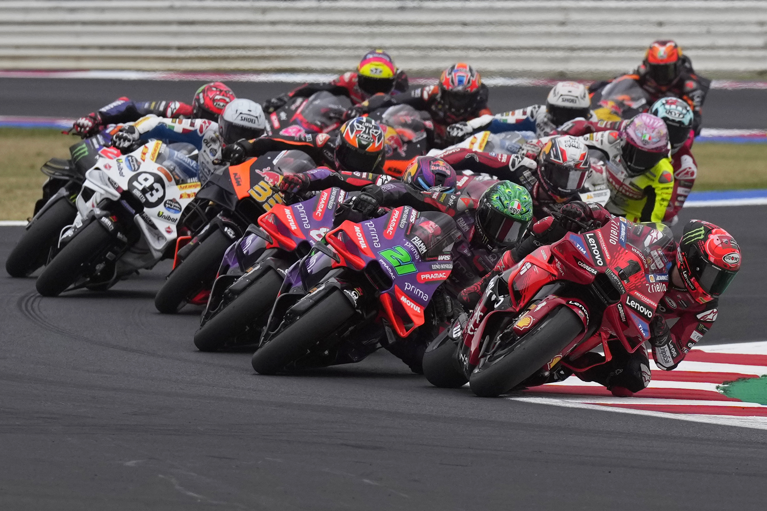 MotoGP rider Francesco Bagnaia of Italy leads into a curve during the first lap of the San Marino Motorcycle Grand Prix at the Misano circuit in Misano Adriatico, Italy, Sunday, Sept. 8, 2024. (AP Photo/Antonio Calanni)