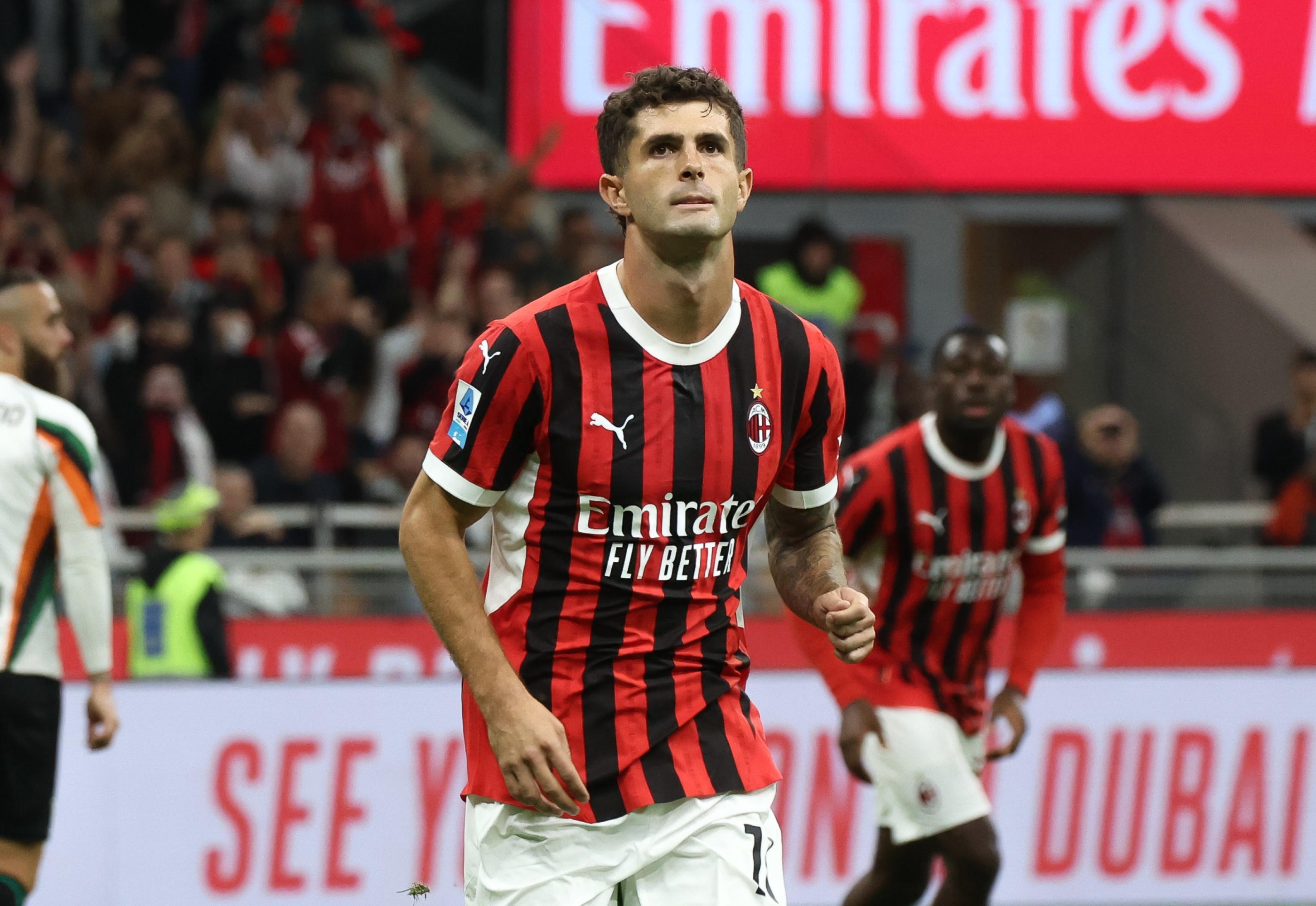 AC Milan's forward Christian Pulisic celebrates after scoring goal during the Italian Serie A soccer match AC Milan vs Venezia FC at Giuseppe Meazza Stadium in Milan, Italy, 14 September 2024. PHOTO / ROBERTO BREGANI