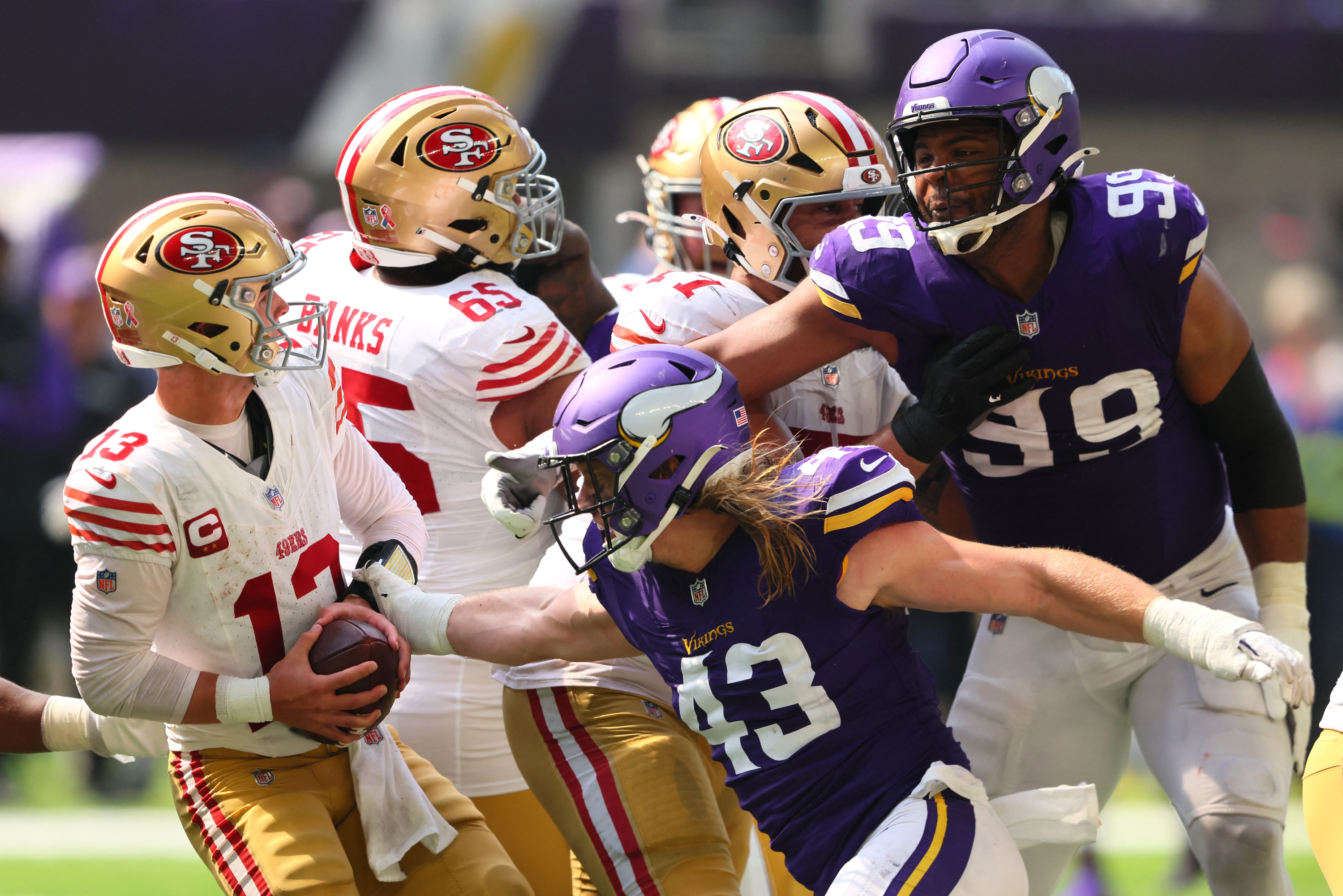 MINNEAPOLIS, MINNESOTA - SEPTEMBER 15: Andrew Van Ginkel #43 of the Minnesota Vikings pressures quarterback Brock Purdy #13 of the San Francisco 49ers during the third quarter at U.S. Bank Stadium on September 15, 2024 in Minneapolis, Minnesota.   Adam Bettcher/Getty Images/AFP (Photo by Adam Bettcher / GETTY IMAGES NORTH AMERICA / Getty Images via AFP)