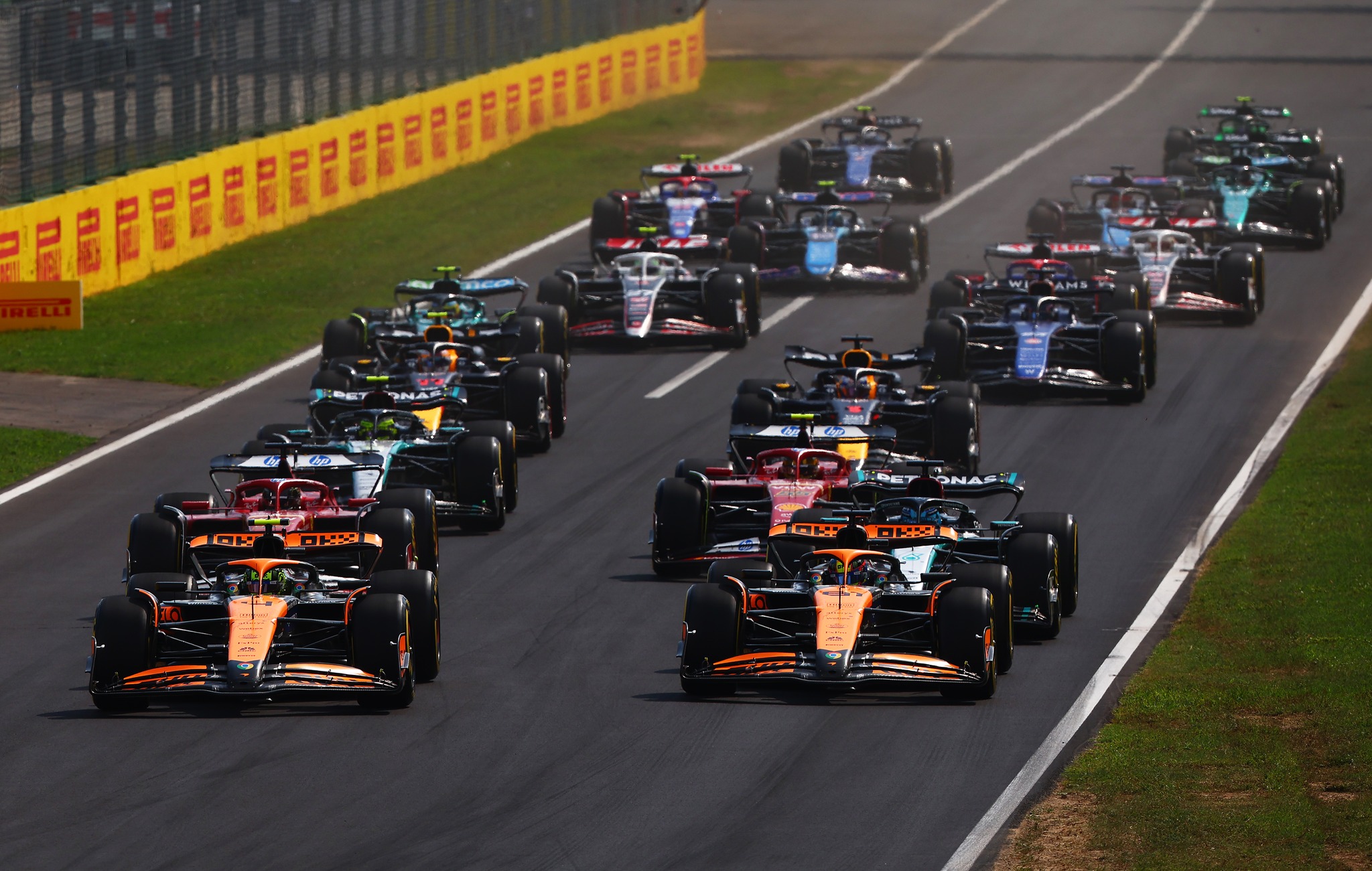 MONZA, ITALY - SEPTEMBER 01: Lando Norris of Great Britain driving the (4) McLaren MCL38 Mercedes leads Oscar Piastri of Australia driving the (81) McLaren MCL38 Mercedes at the start prior to the F1 Grand Prix of Italy at Autodromo Nazionale Monza on September 01, 2024 in Monza, Italy. (Photo by Joe Portlock - Formula 1/Formula 1 via Getty Images)