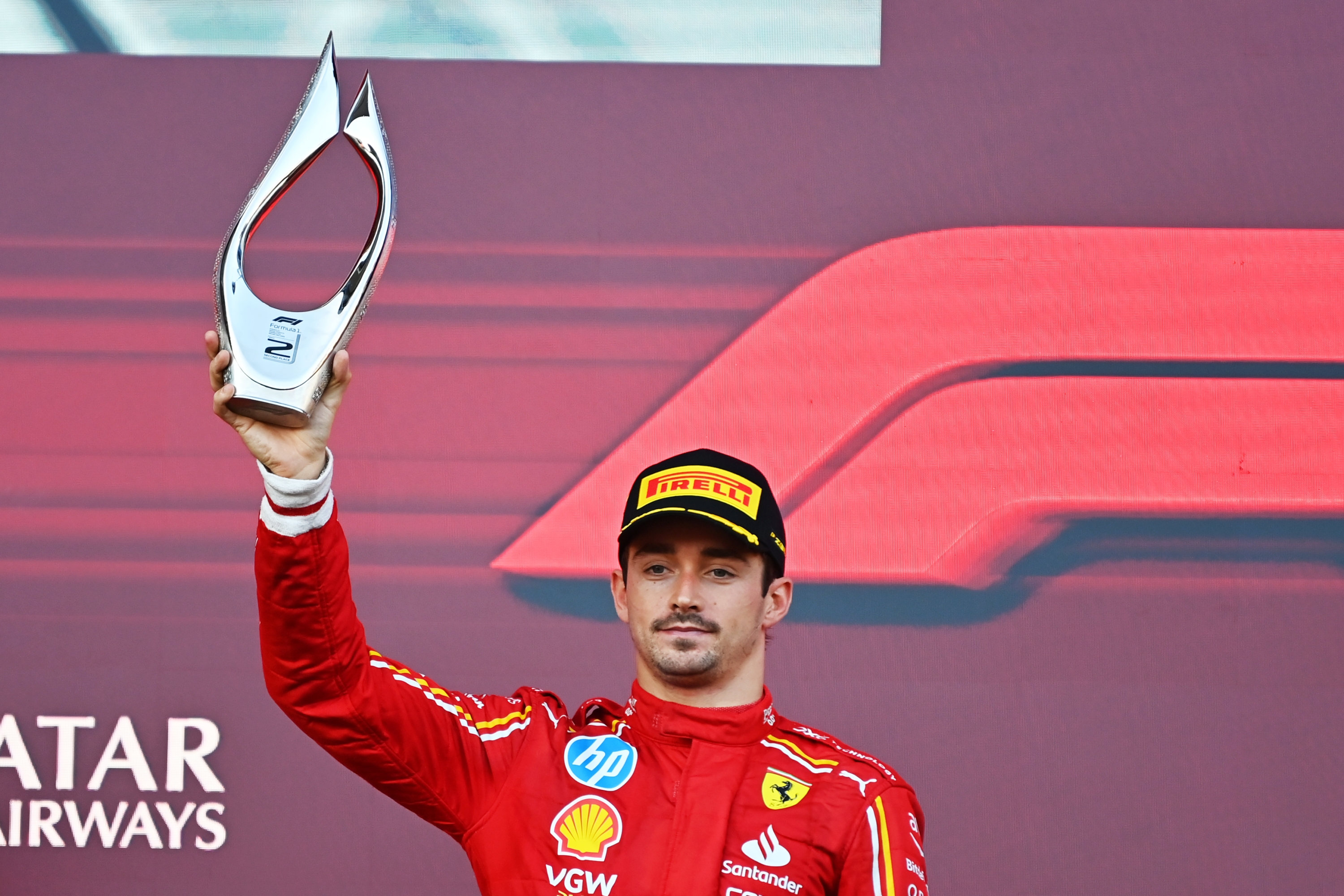 BAKU, AZERBAIJAN - SEPTEMBER 15: Second placed Charles Leclerc of Monaco and Ferrari celebrates on the podium during the F1 Grand Prix of Azerbaijan at Baku City Circuit on September 15, 2024 in Baku, Azerbaijan. (Photo by James Sutton/Getty Images)