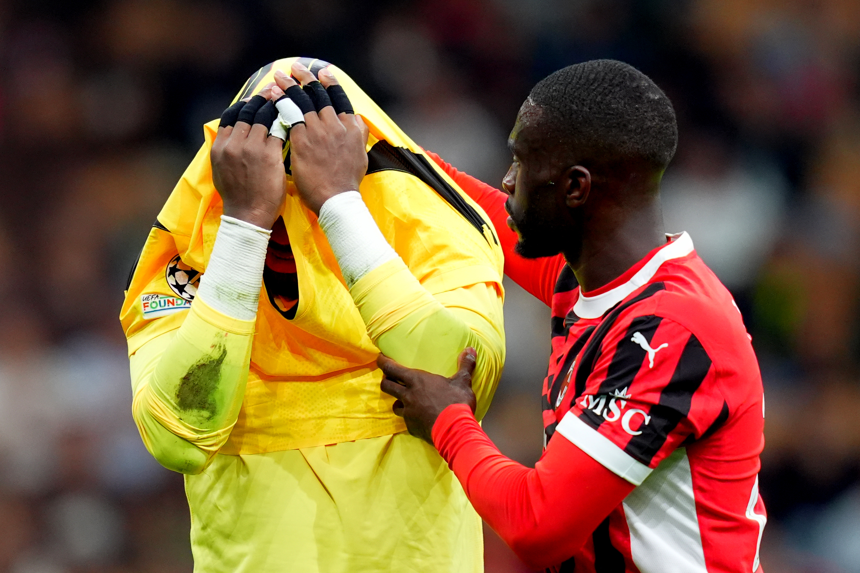 AC Milan's goalkeeper Mike Maignan , AC Milan's Fikayo Timori  during the Uefa Champions League soccer match between Milan and Liverpool at the San Siro Stadium in Milan, north Italy -Tuesday , September 17 2024. Sport - Soccer . (Photo by Spada/LaPresse)