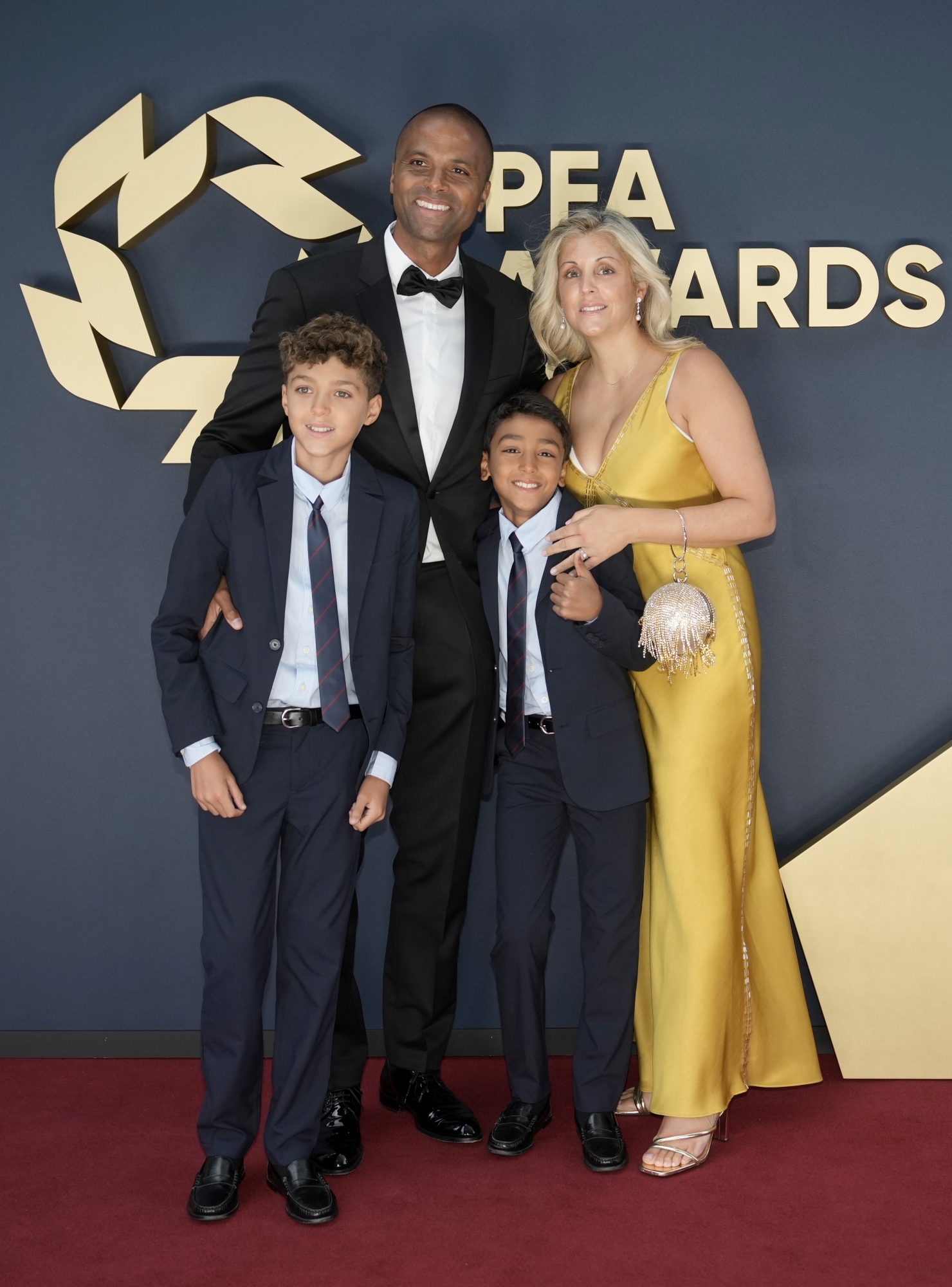 MANCHESTER, ENGLAND - AUGUST 20: Maheta Molango (second left) and guests attend the PFA Awards 2024 at Manchester Opera House on August 20, 2024 in Manchester, England.  (Photo by Christopher Furlong/Getty Images)