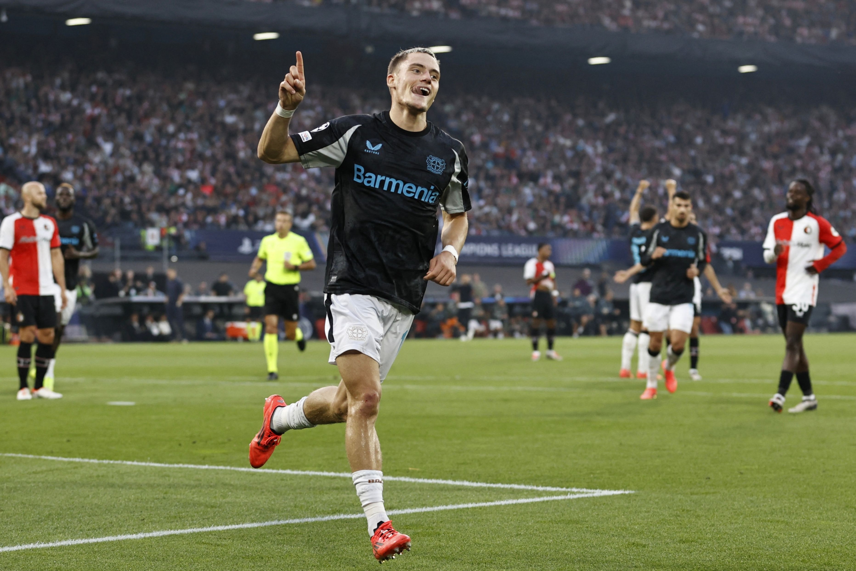 Bayer Leverkusen's German midfielder #10 Florian Wirtz celebrates scoring a goal during the UEFA Champions League 1st round day 1 football match between Feyenoord and Bayer Leverkusen at The De Kuip Stadium, in Rotterdam on September 19, 2024. (Photo by MAURICE VAN STEEN / ANP / AFP) / Netherlands OUT