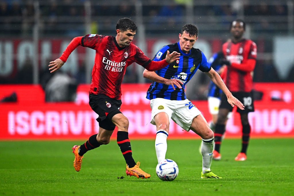 MILAN, ITALY - APRIL 22: Christian Pulisic of Milan competes for the ball with Benjamin Pavard of Inter during the Serie A TIM match between AC Milan and FC Internazionale at Stadio Giuseppe Meazza on April 22, 2024 in Milan, Italy. (Photo by Mattia Ozbot - Inter/Inter via Getty Images)