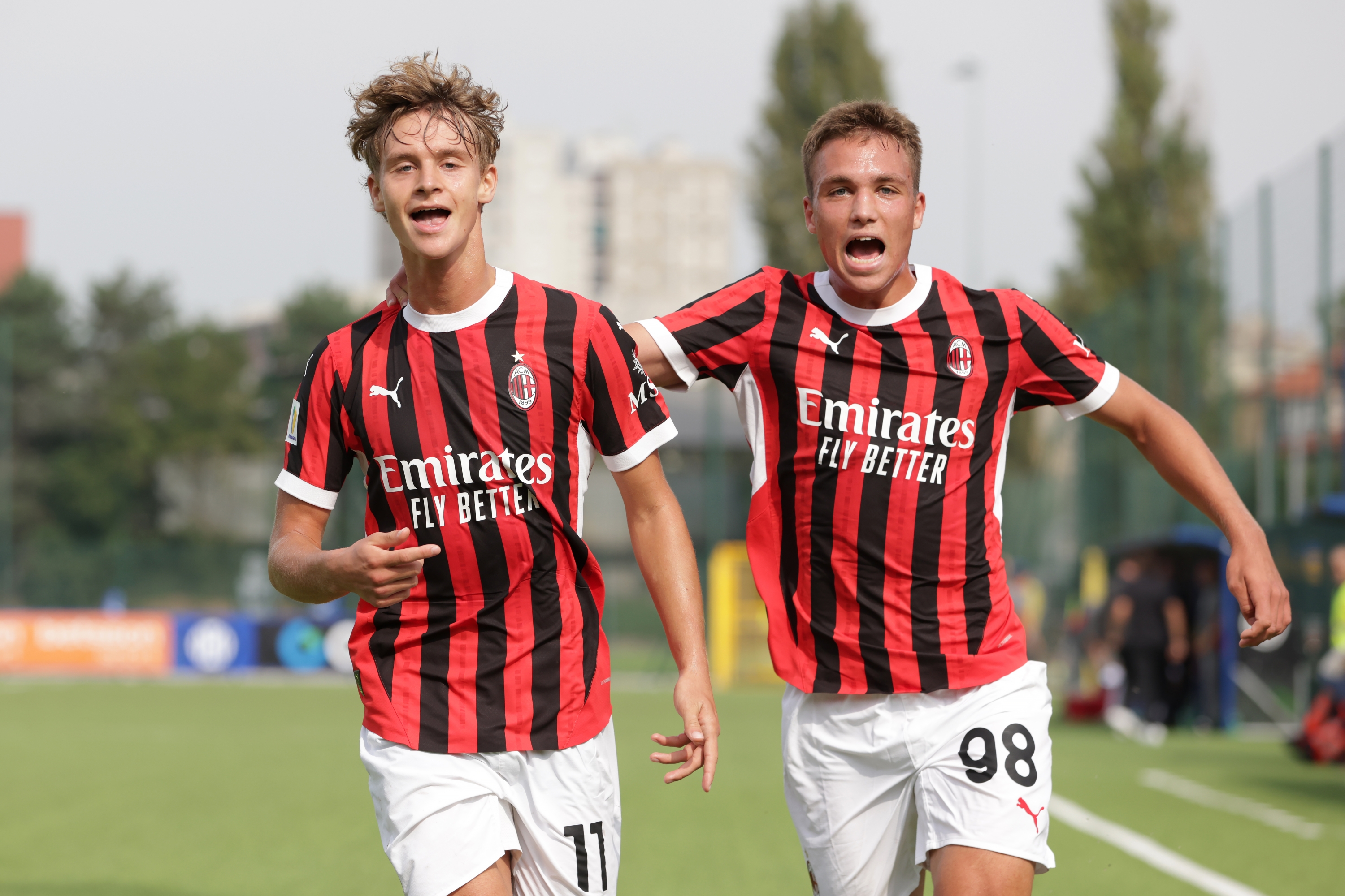 MILAN, ITALY - SEPTEMBER 22: Maximilian Ibrahimovic of AC Milan celebrates with team mate Vittorio Magni after scoring to give the side a 2-0 lead during the Primavera 1 match between FC Internazionale and AC Milan at Centro Sportivo Interello Giacinto Facchetti on September 22, 2024 in Milan, Italy. (Photo by Jonathan Moscrop/Getty Images)