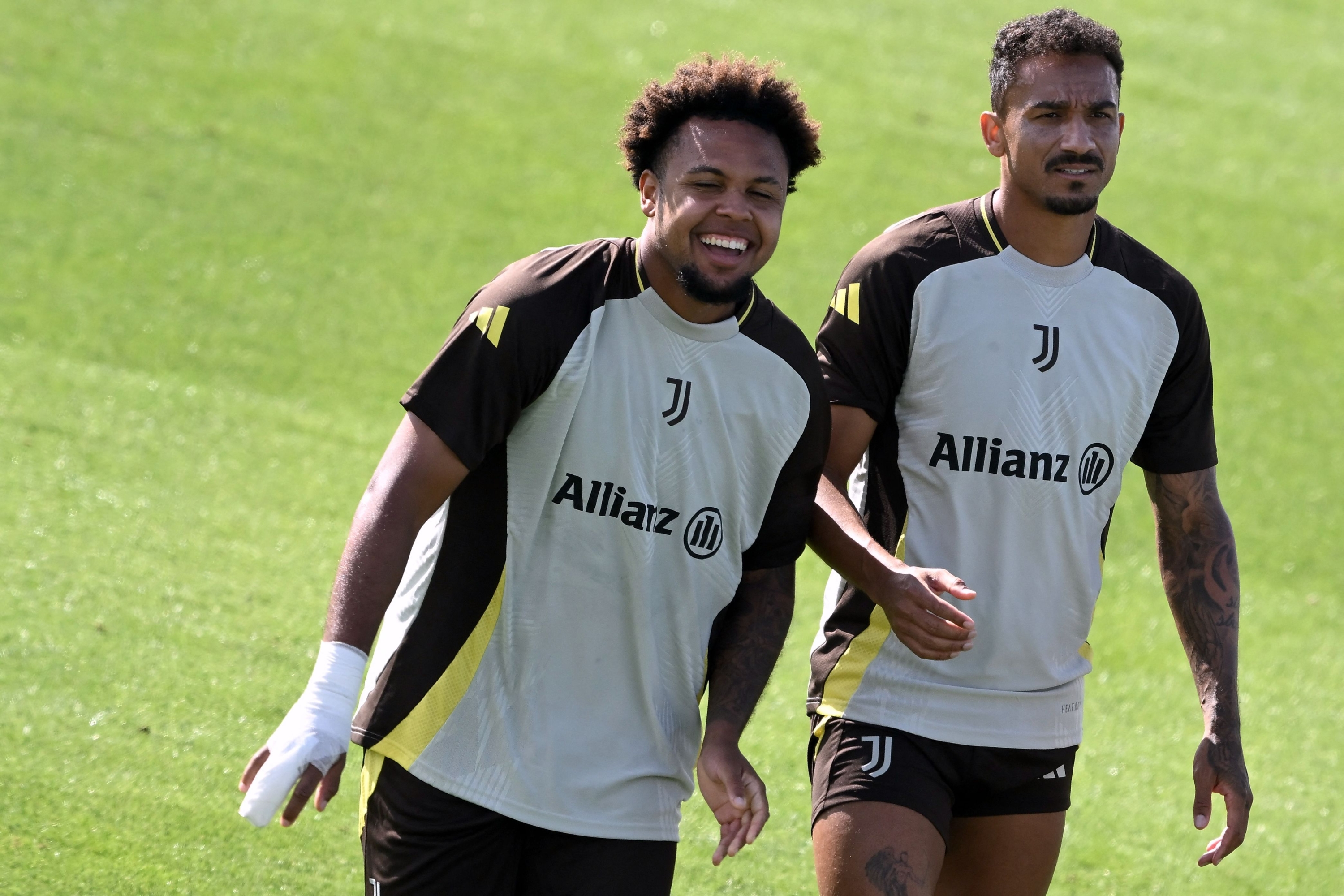 Juventus US midfielder #16 Weston McKennie (L) and Juventus Brazilian defender #06 Danilo take part in a training session at  JTC Continassa in Turin on the eve of their League Phase, Matchday 1  of UEFA Champions League football match against PSV Eindhoven, on September 16, 2024. (Photo by MARCO BERTORELLO / AFP)