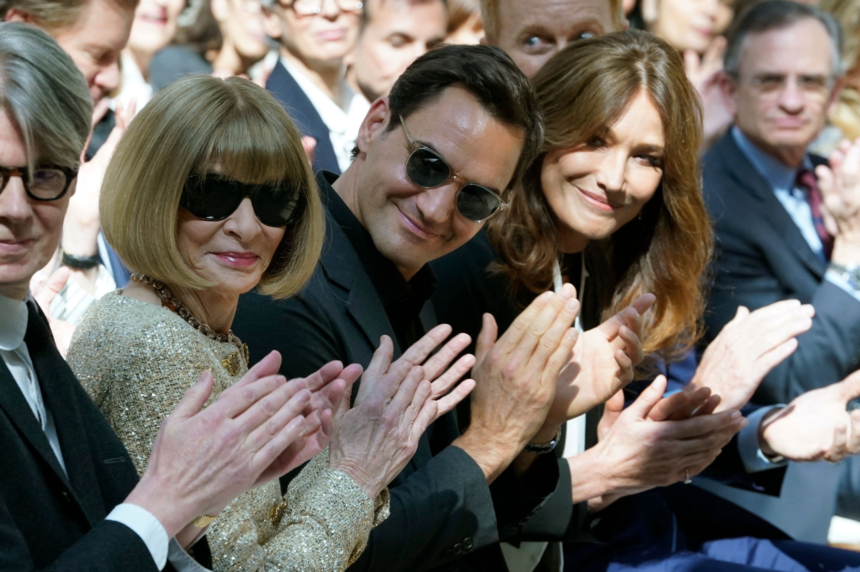 English magazine editor Anna Wintour, Swiss tennis player Roger Federer, and French singer and model Carla Bruni attend the press preview of The Costume Institute's exhibition titled Karl Lagerfeld: A Line of Beauty, at The Metropolitan Museum of Art in New York City on May 1, 2023. (Photo by TIMOTHY A. CLARY / AFP) (Photo by TIMOTHY A. CLARY/AFP via Getty Images)