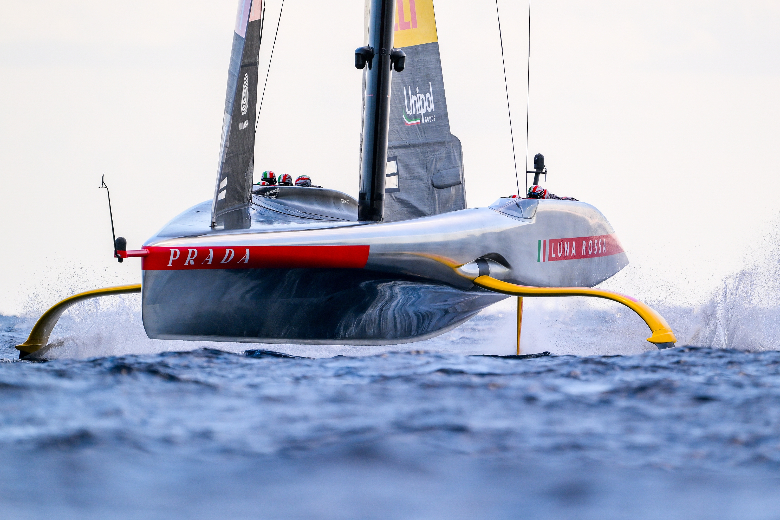 BARCELONA, SPAIN - OCTOBER 04: The AC75 Luna Rossa Prada Pirelli Team competes against The AC75 Ineos Britannia team during race 11 of the Louis Vuitton Cup Final - 37th America's Cup on October 04, 2024 in Barcelona, Spain. (Photo by David Ramos/Getty Images)