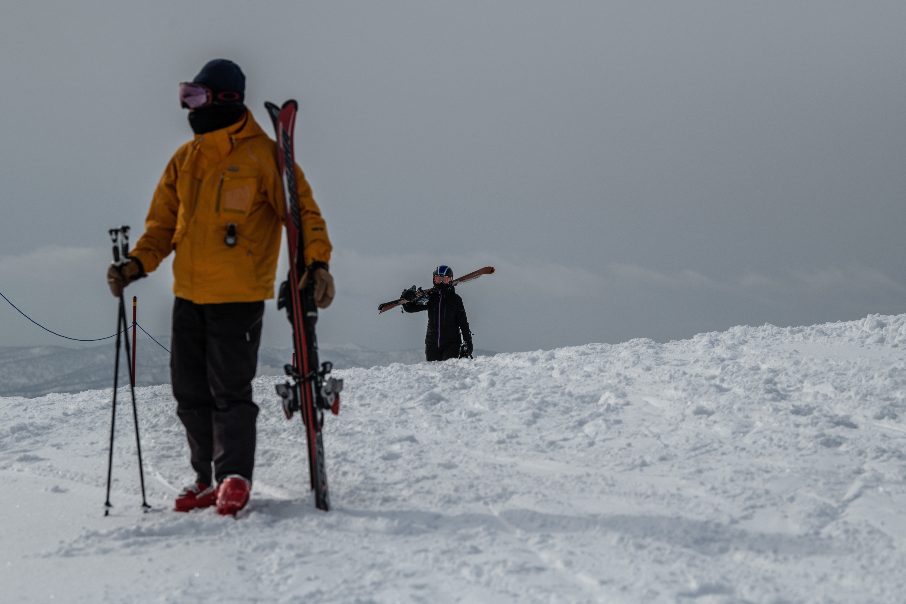 NISEKO, JAPAN - JANUARY 28: Skiers walk to a slope on January 28, 2021 in Niseko, Japan. As one of Asias most popular ski resorts, Niseko usually welcomes huge numbers of foreign tourists each winter, with around 85 percent coming from abroad. However, as the Covid-19 coronavirus pandemic continues to halt almost all foreign travel, the resort, like many other tourist destinations in Japan, has seen a huge drop in visitor numbers which is putting a significant financial burden on local businesses with many having to close, at least temporarily. (Photo by Carl Court/Getty Images)