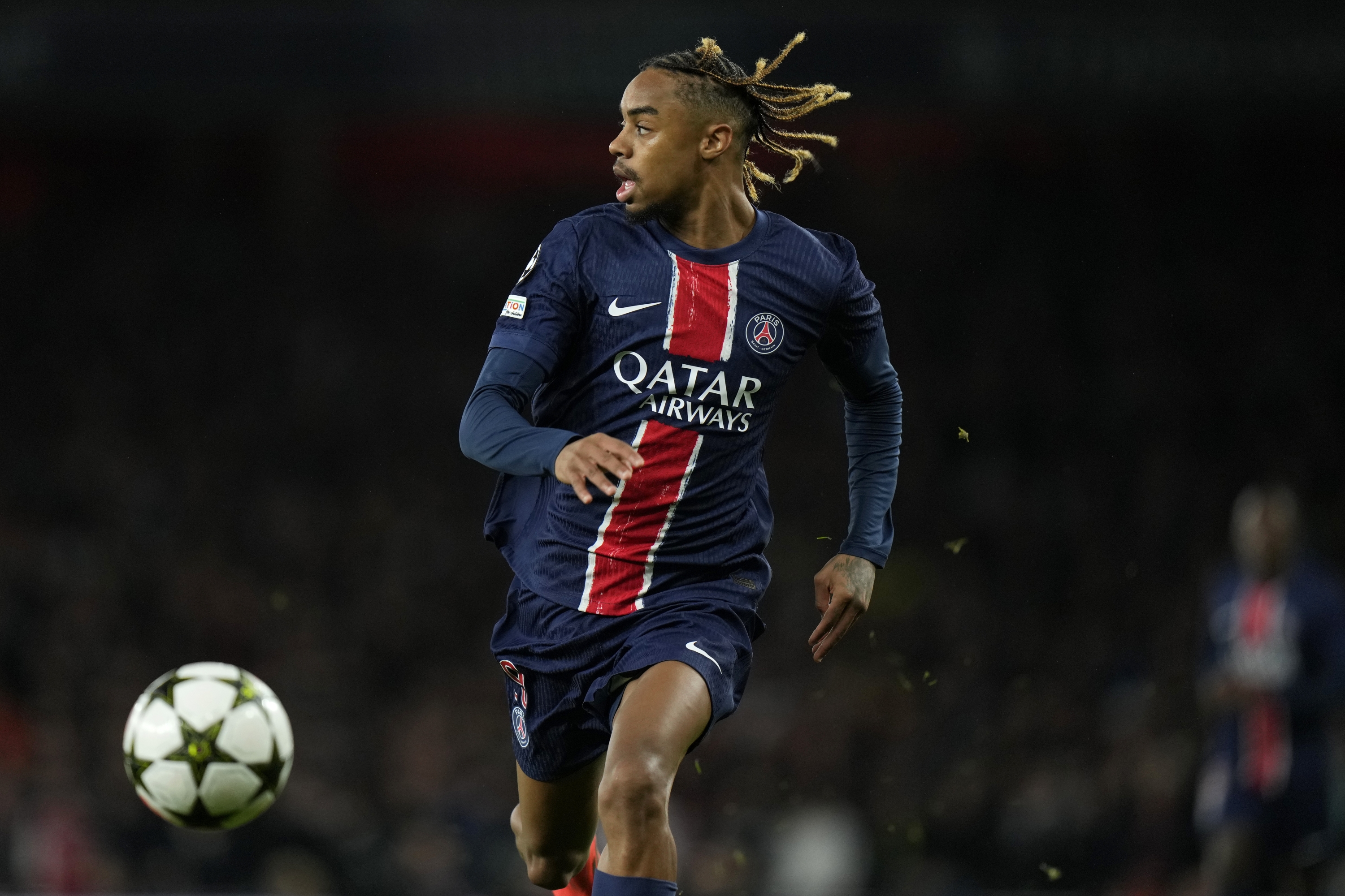 PSG's Bradley Barcola runs with the ball during a Champions League opening phase soccer match between Arsenal FC and Paris Saint-Germain at Arsenal stadium in London, England, Tuesday, Oct. 1, 2024. (AP Photo/Alastair Grant)