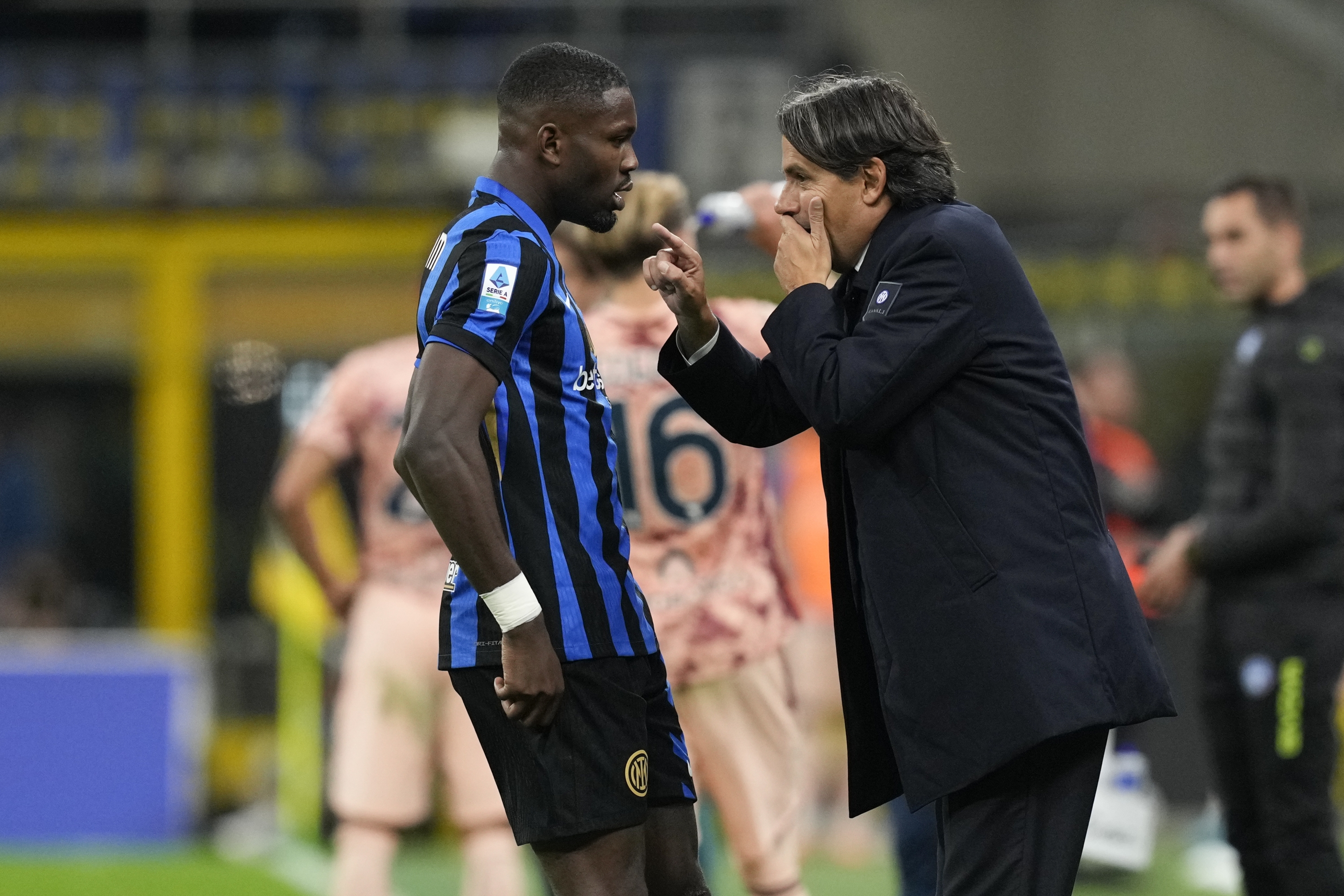 Inter Milan's Marcus Thuram, left, listens his coach Simone Inzaghi during the Serie A soccer match between Inter Milan and Torino at the San Siro Stadium, in Milan, Italy, Saturday, Oct. 5, 2024. (AP Photo/Antonio Calanni)