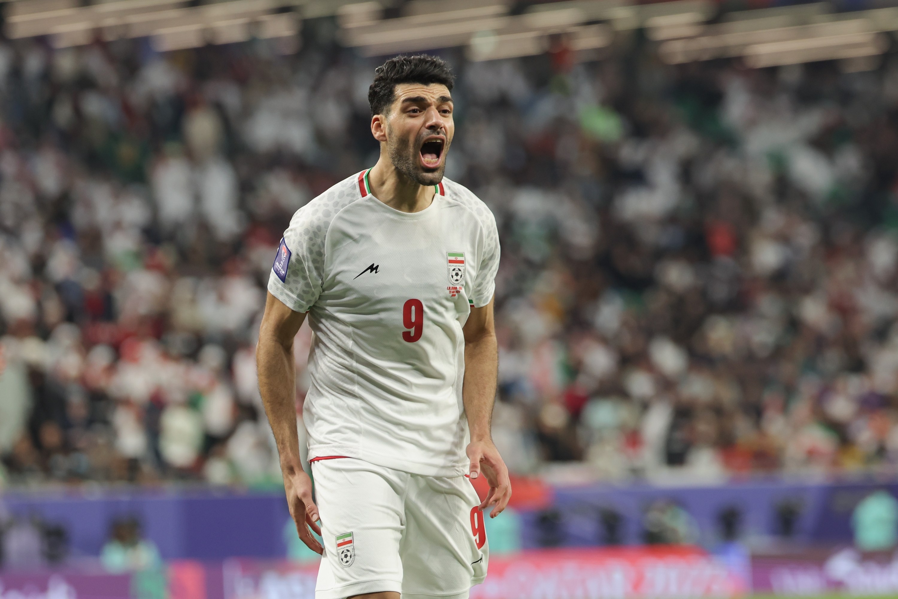 AL RAYYAN, QATAR - JANUARY 23: Mehdi Taremi of Iran celebrates scoring his team's second goal during the AFC Asian Cup Group C match between Iran and United Arab Emirates at Education City Stadium on January 23, 2024 in Al Rayyan, Qatar. (Photo by Lintao Zhang/Getty Images)