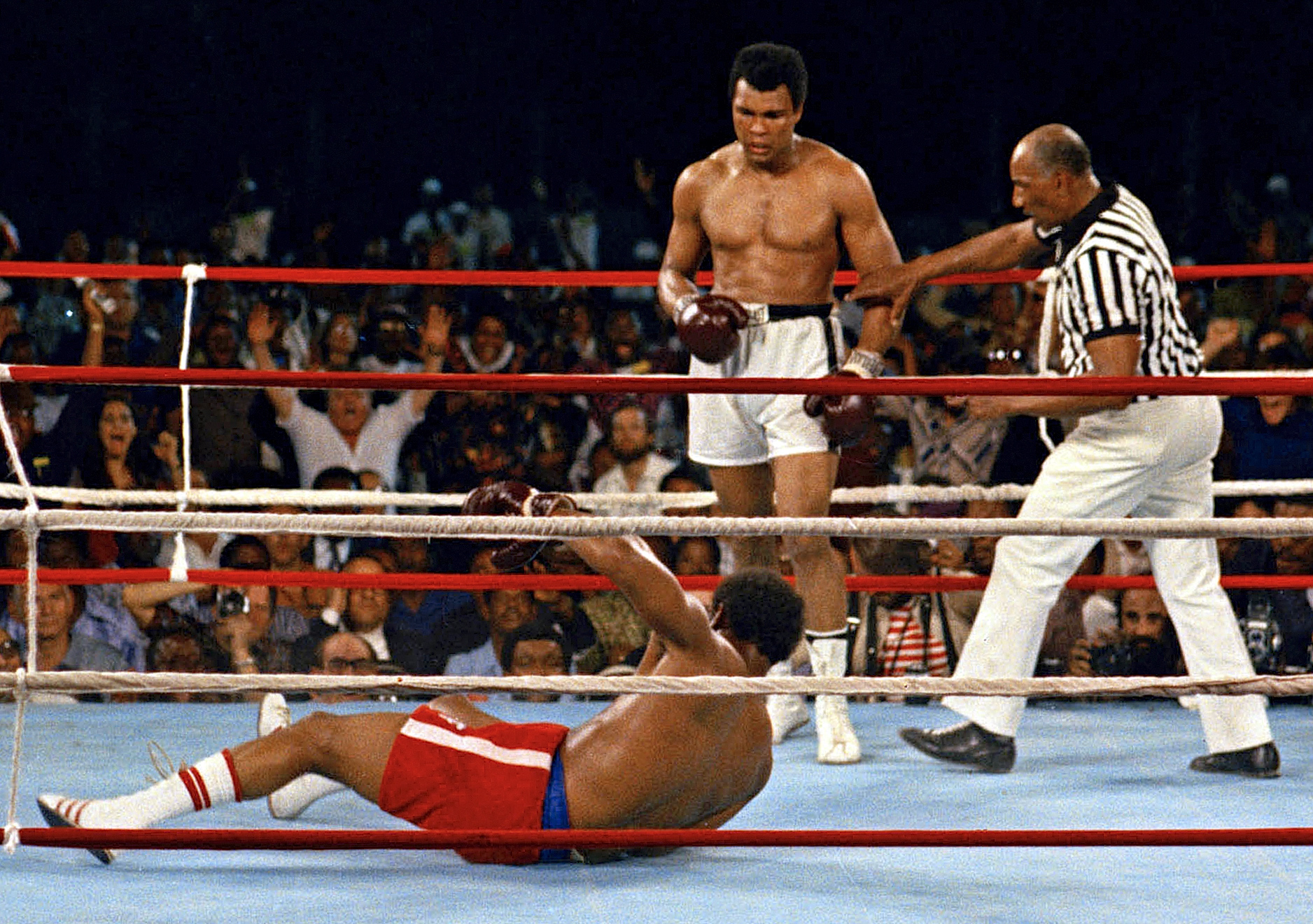 Muhammad Ali looks down at George Foreman during their bout in Kinshasa, Zaire, Oct. 30, 1974.  (AP Photo)