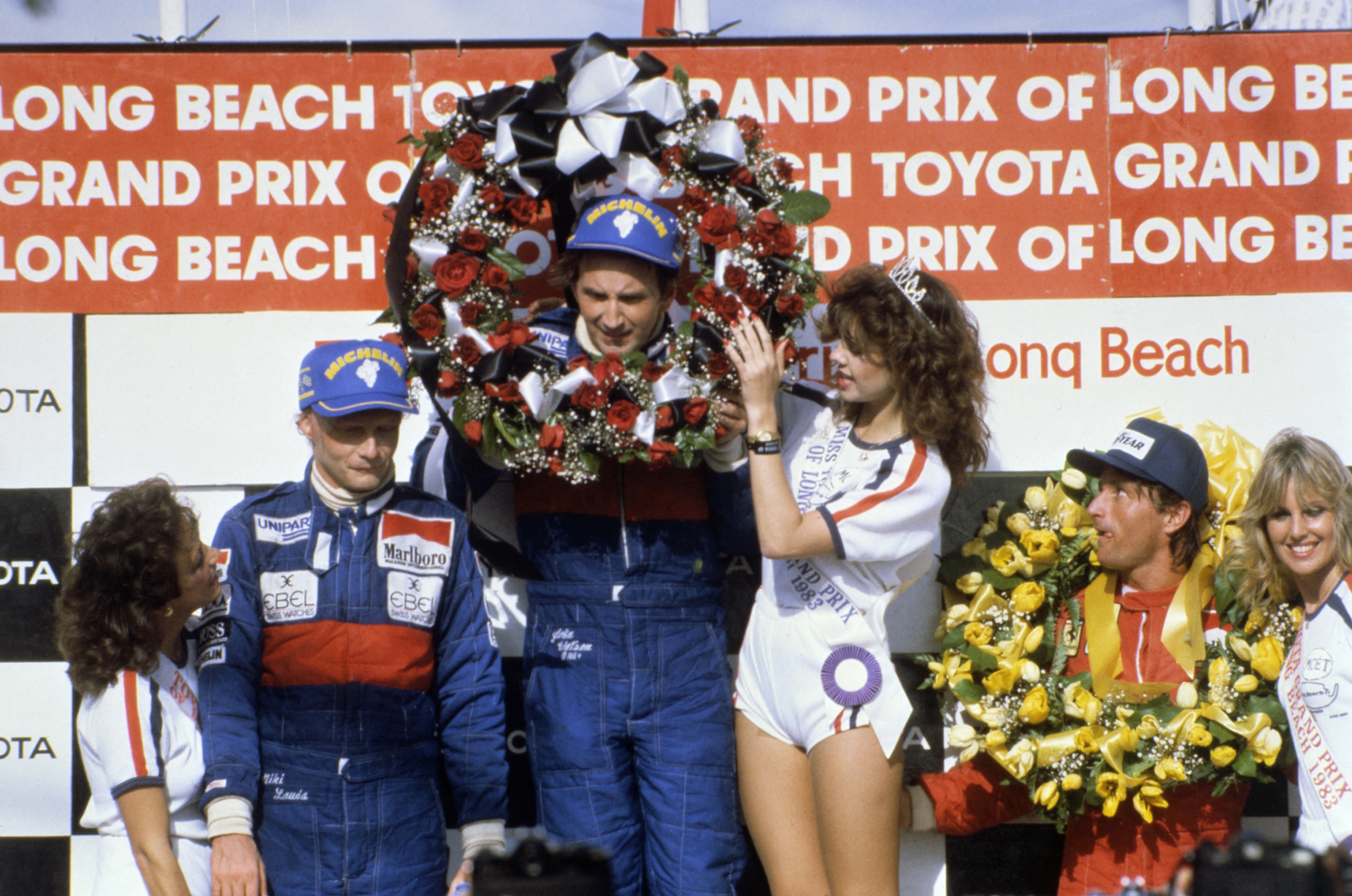 from L to R: Austrian Niki Lauda, England's John Watson and French René Arnoux, pose on the podium at the end of the Toyota Long Beach Grand Prix, 27 march 1983. (Photo by LEHTIKUVA / AFP)