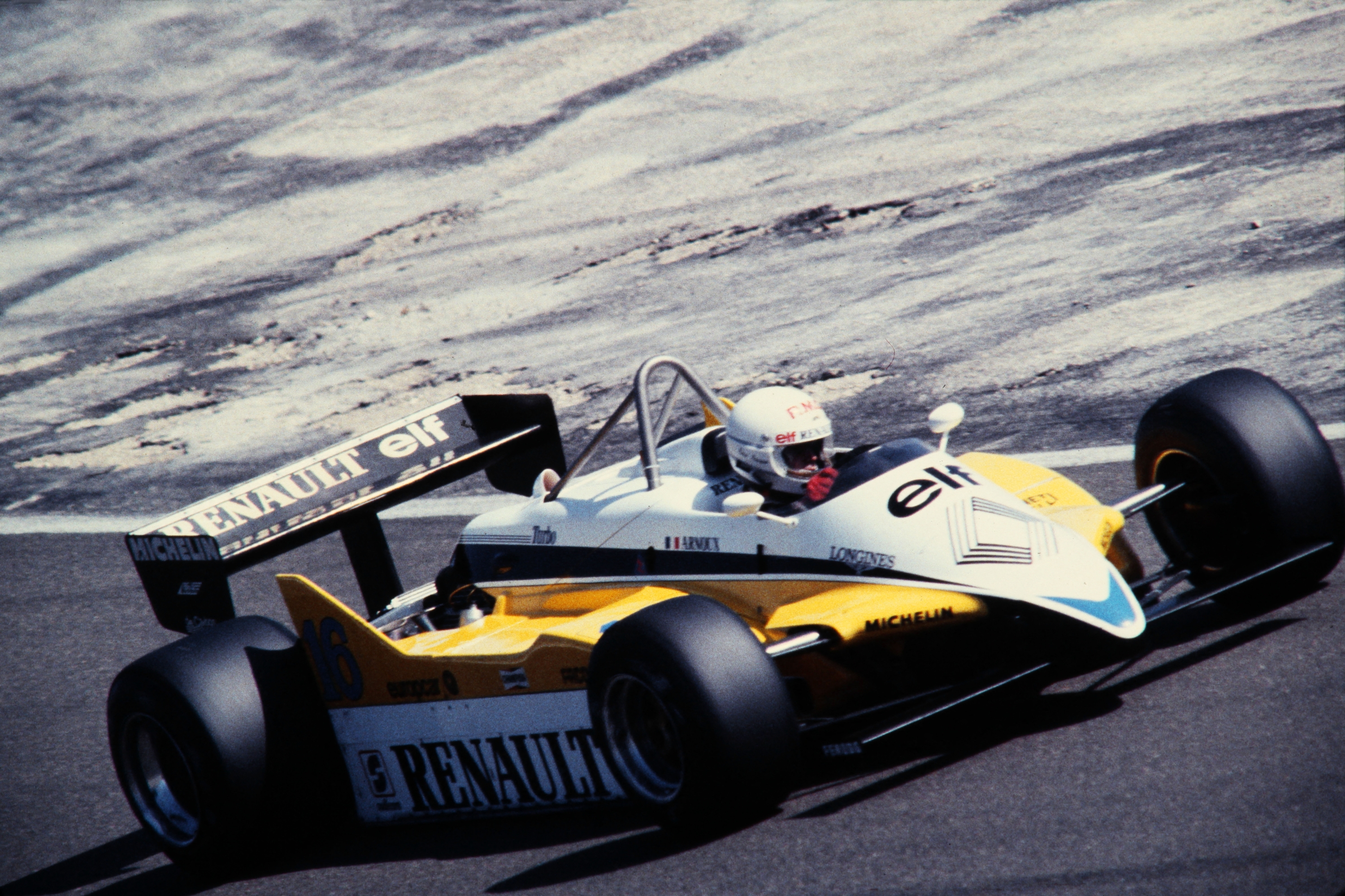 Picture taken on August 28, 1982 at Dijon, center France, showing French racing driver René Arnoux driving a Renault on the motor-racing track during a practice session of Switzerland's Grand Prix. (Photo by AFP)