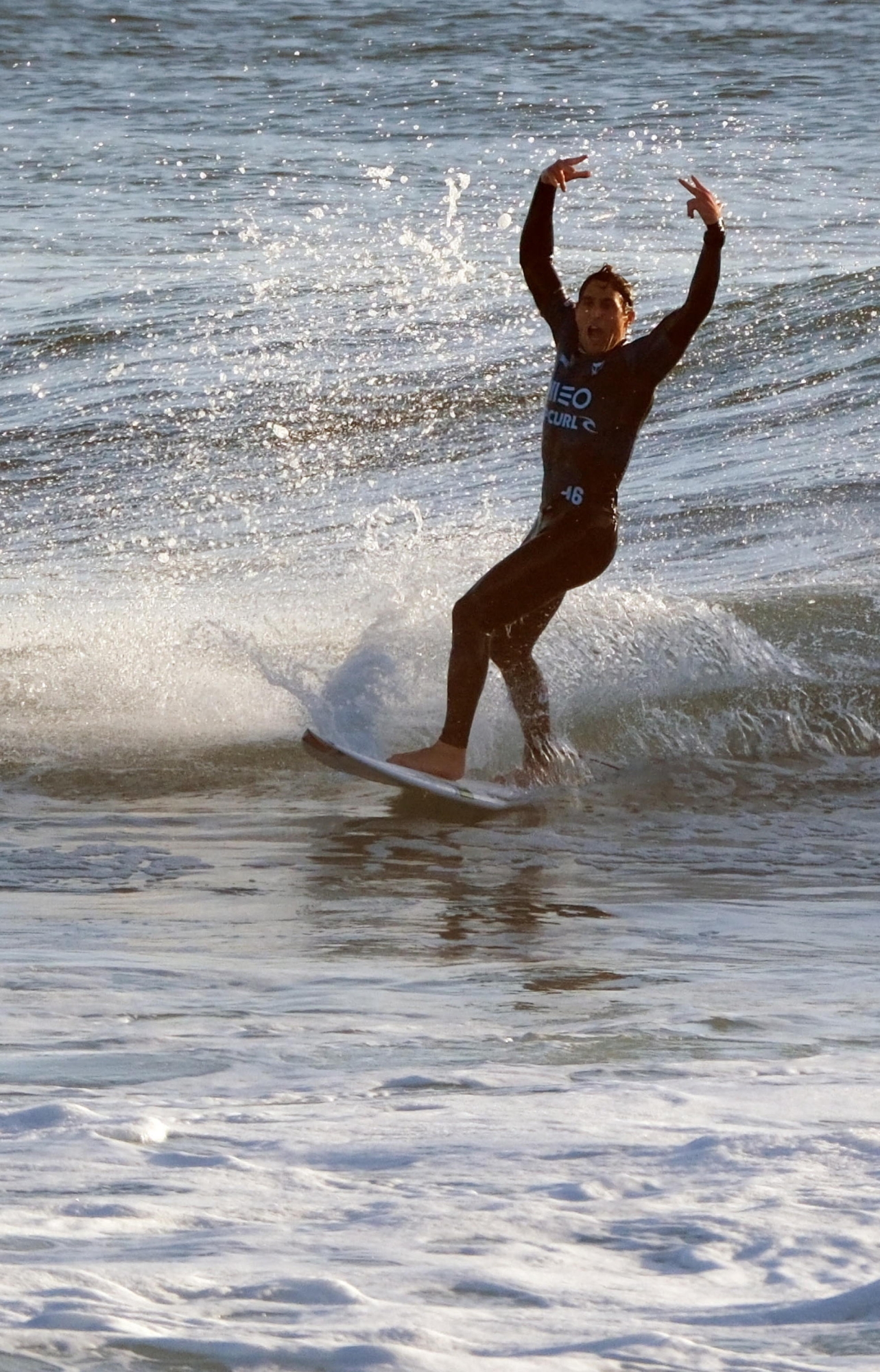 epa11215086 Italian surfer Leonardo Fioravanti celebrates reaching the quarter finals of the World Surfing Championship stage at Praia dos Super Tubos in Peniche, Portugal, 11 March 2024.  EPA/CARLOS BARROSO