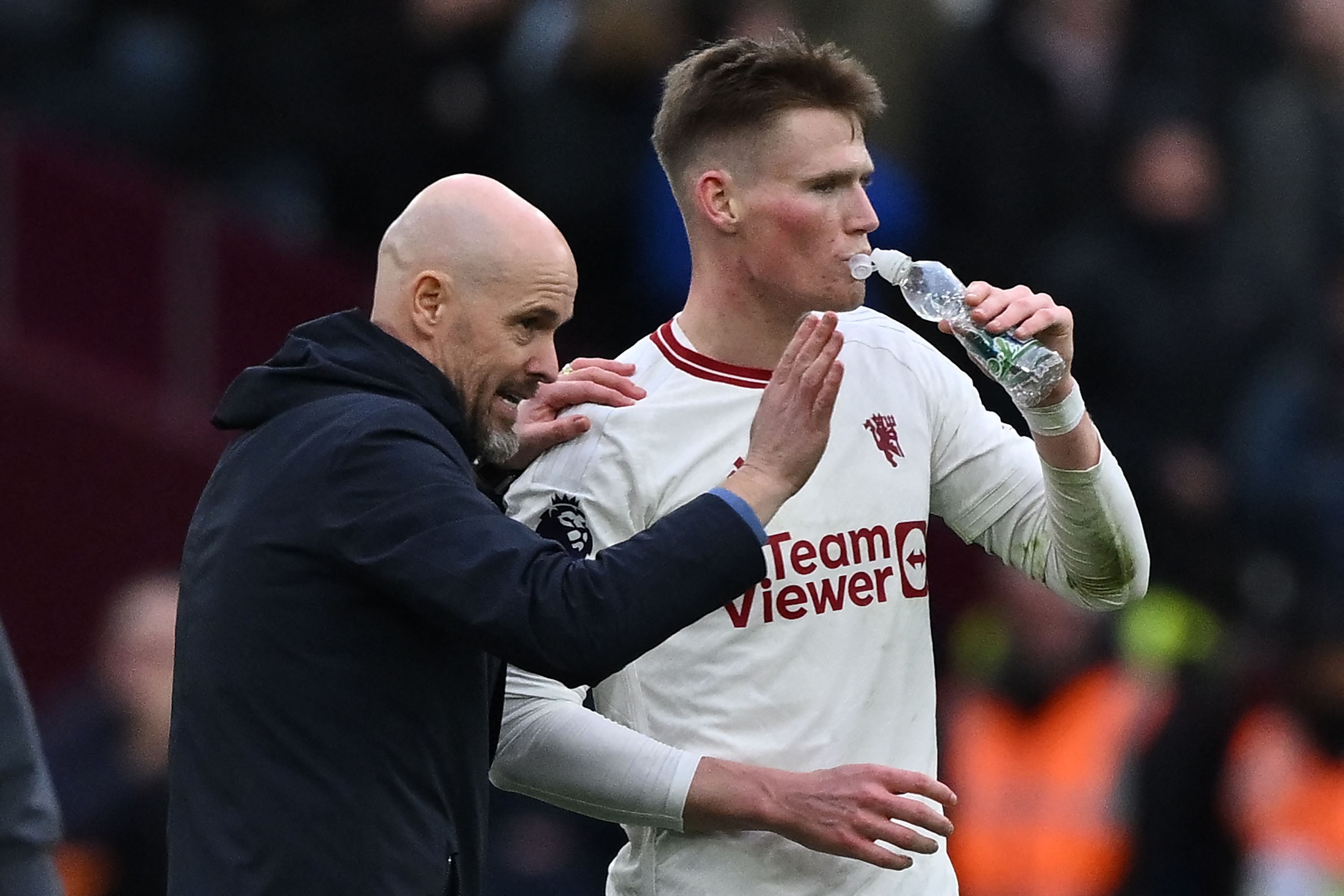 Manchester United's Dutch manager Erik ten Hag (L) gives instructions to Manchester United's Scottish midfielder #39 Scott McTominay (R) during the English Premier League football match between West Ham United and Manchester United at the London Stadium, in London on December 23, 2023. (Photo by Ben Stansall / AFP) / RESTRICTED TO EDITORIAL USE. No use with unauthorized audio, video, data, fixture lists, club/league logos or 'live' services. Online in-match use limited to 120 images. An additional 40 images may be used in extra time. No video emulation. Social media in-match use limited to 120 images. An additional 40 images may be used in extra time. No use in betting publications, games or single club/league/player publications. /