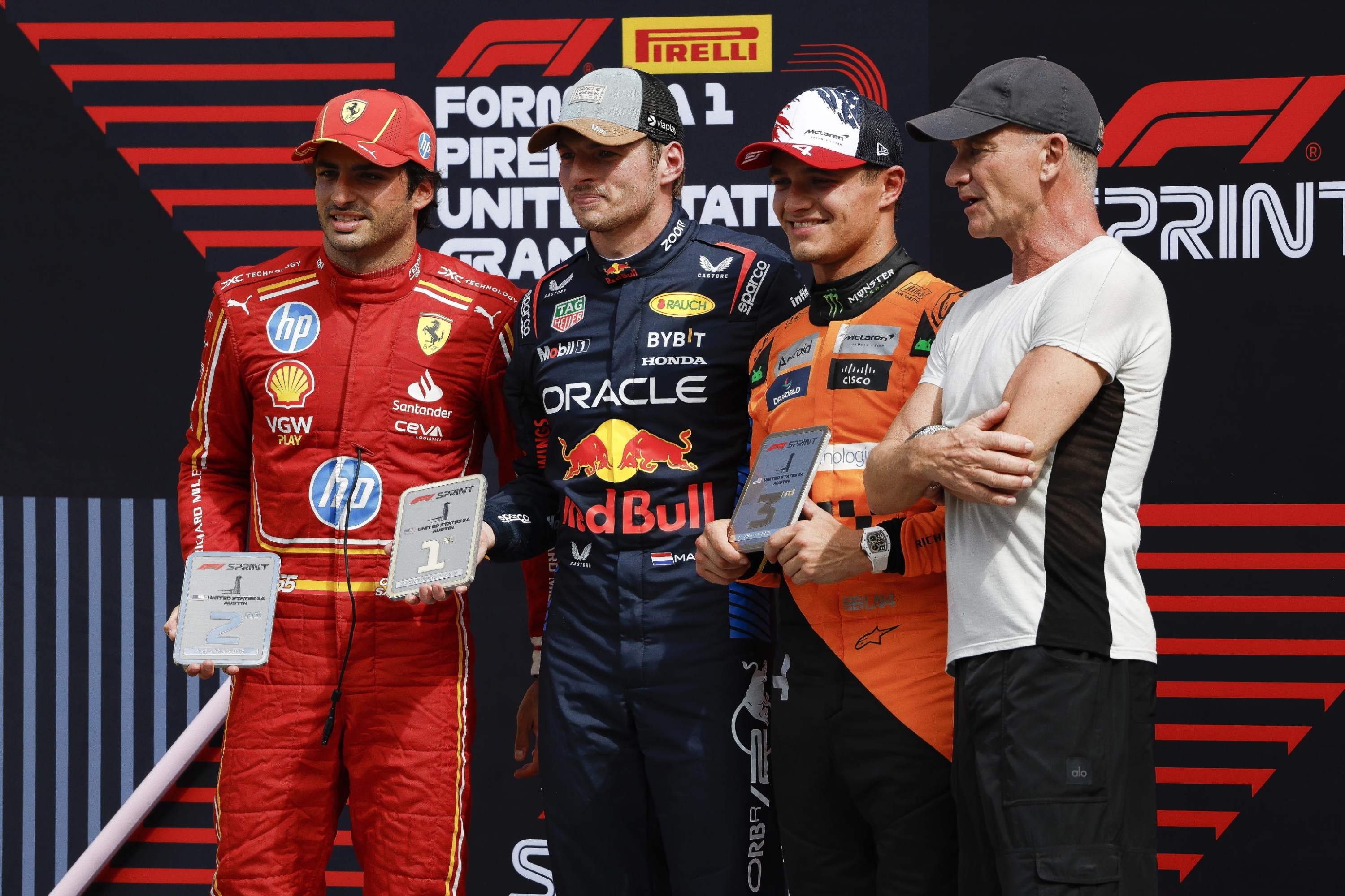 epa11669429 First place, Max Verstappen of the Netherlands for Team Red Bull Racing (2-L), Second place, Carlos Sainz of Spain for Team Ferrari (L), Third place, Lando Norris of United Kingdom for Team McLaren (2-R), and award presentor, Sting, musican and actor from United Kingdom (R) pose for photos after the Sprint race in Austin, TX, USA, 19 October 2024. The 2024 Formula 1 United States Grand Prix is held at the Circuit of the Americas on 20 October.  EPA/JOHN MABANGLO