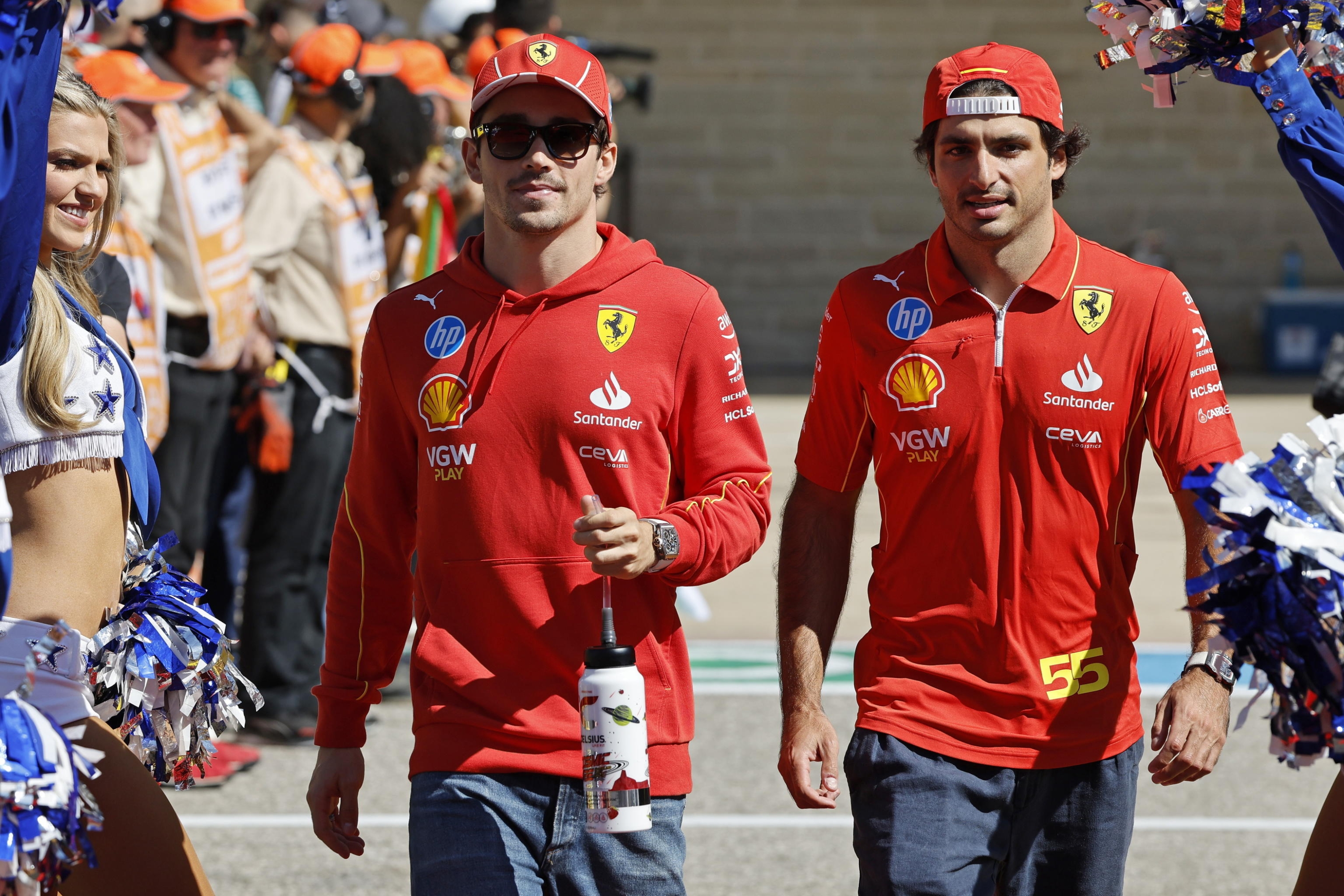 epa11671766 Charles Leclerc of Monaco (L) and Carlos Sainz of Spain (R) for Team Ferrari during the Driverâ??s Parade before the Formula One United States Grand Prix, at the Cirtcuit of the Americas in Austin, TX, USA, 20 October 2024.  EPA/JOHN MABANGLO