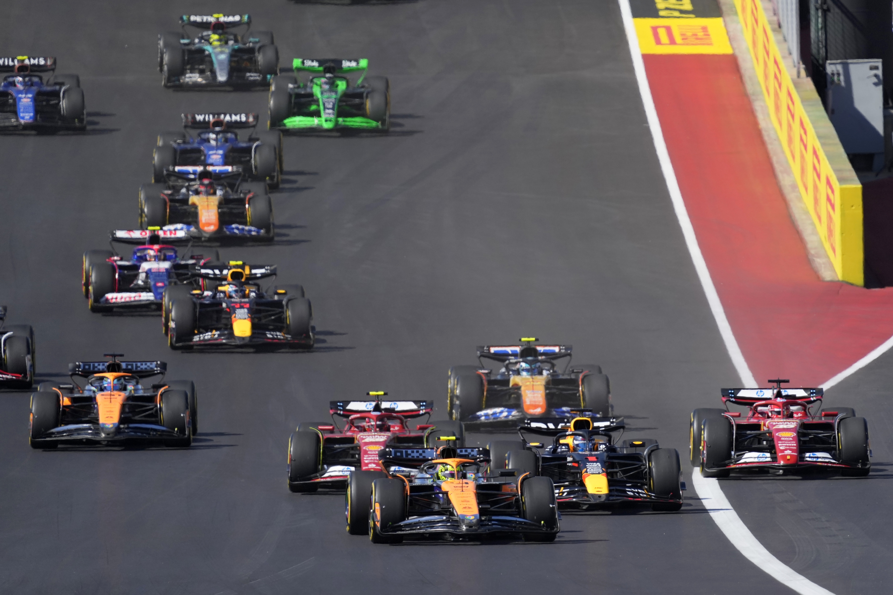 McLaren driver Lando Norris, of Britain, leads drives into Turn 1 during the U.S. Grand Prix auto race at Circuit of the Americas, Sunday, Oct. 20, 2024, in Austin, Texas. (AP Photo/Eric Gay)