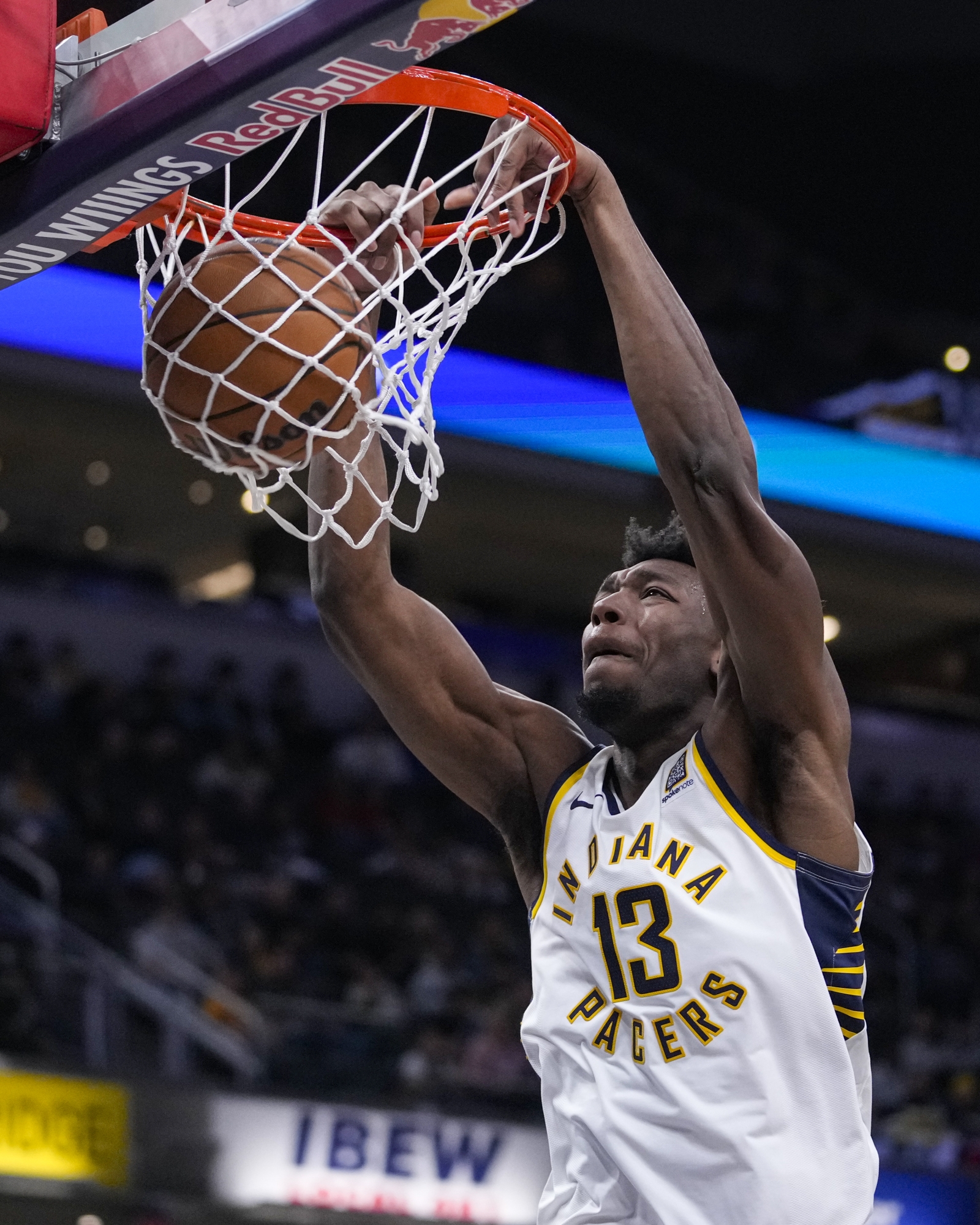 Indiana Pacers center James Wiseman (13) gets a basket on a dunk against the Charlotte Hornets during the second half of an NBA preseason basketball game in Indianapolis, Thursday, Oct. 17, 2024. (AP Photo/Michael Conroy)