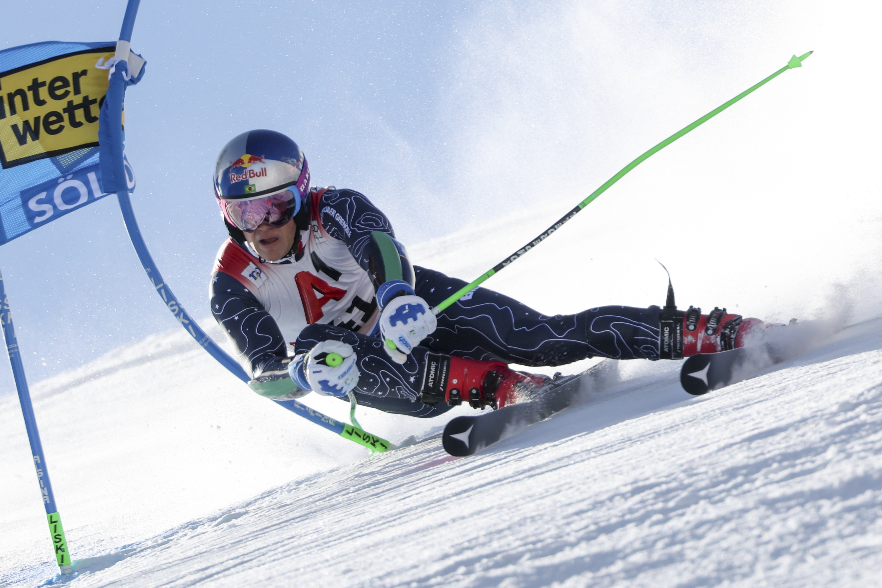 Brazil's Lucas Pinheiro Braathen speeds down the course during an alpine ski, men's World Cup giant slalom, in Soelden, Austria, Sunday, Oct. 27, 2024. (AP Photo/Marco Trovati)