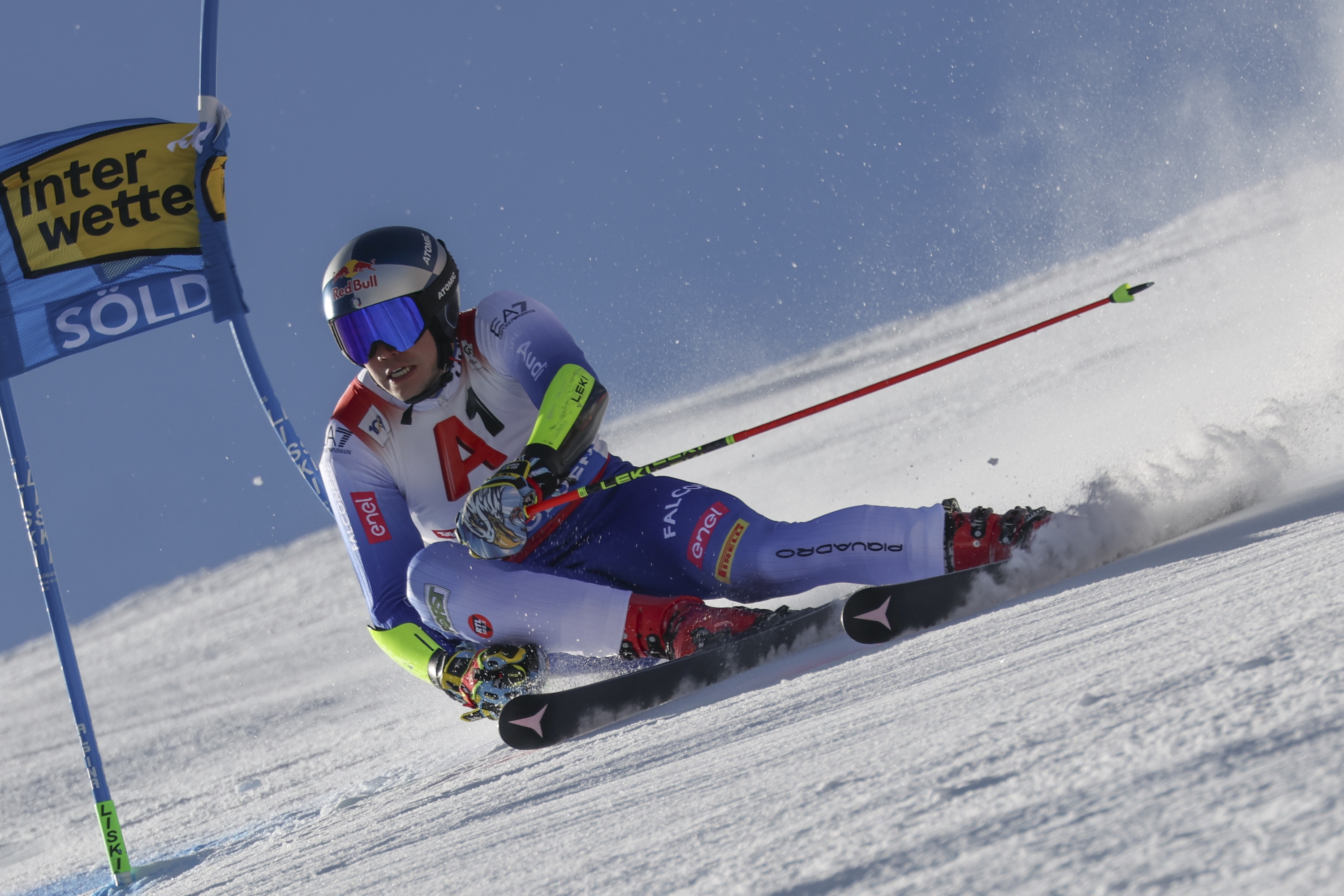 Italy's Alex Vinatzer speeds down the course during an alpine ski, men's World Cup giant slalom, in Soelden, Austria, Sunday, Oct. 27, 2024. (AP Photo/Marco Trovati)