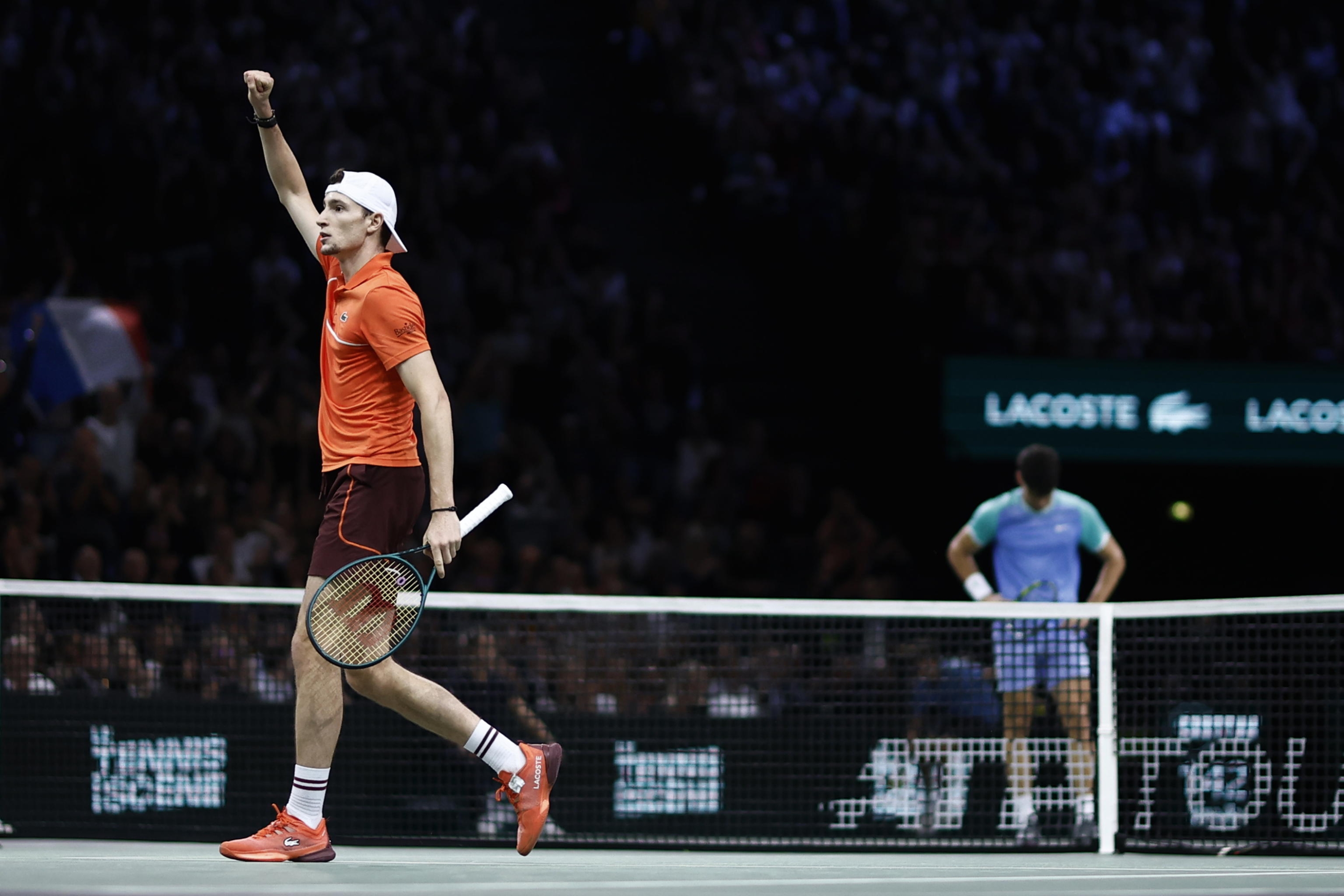 epa11694956 Ugo Humbert (L) of France celebrates winning a game during his round of 16 match against Carlos Alcaraz (R) of Spain at the Rolex Paris Masters tennis tournament in Paris, France, 31 October 2024.  EPA/YOAN VALAT Alternative crop