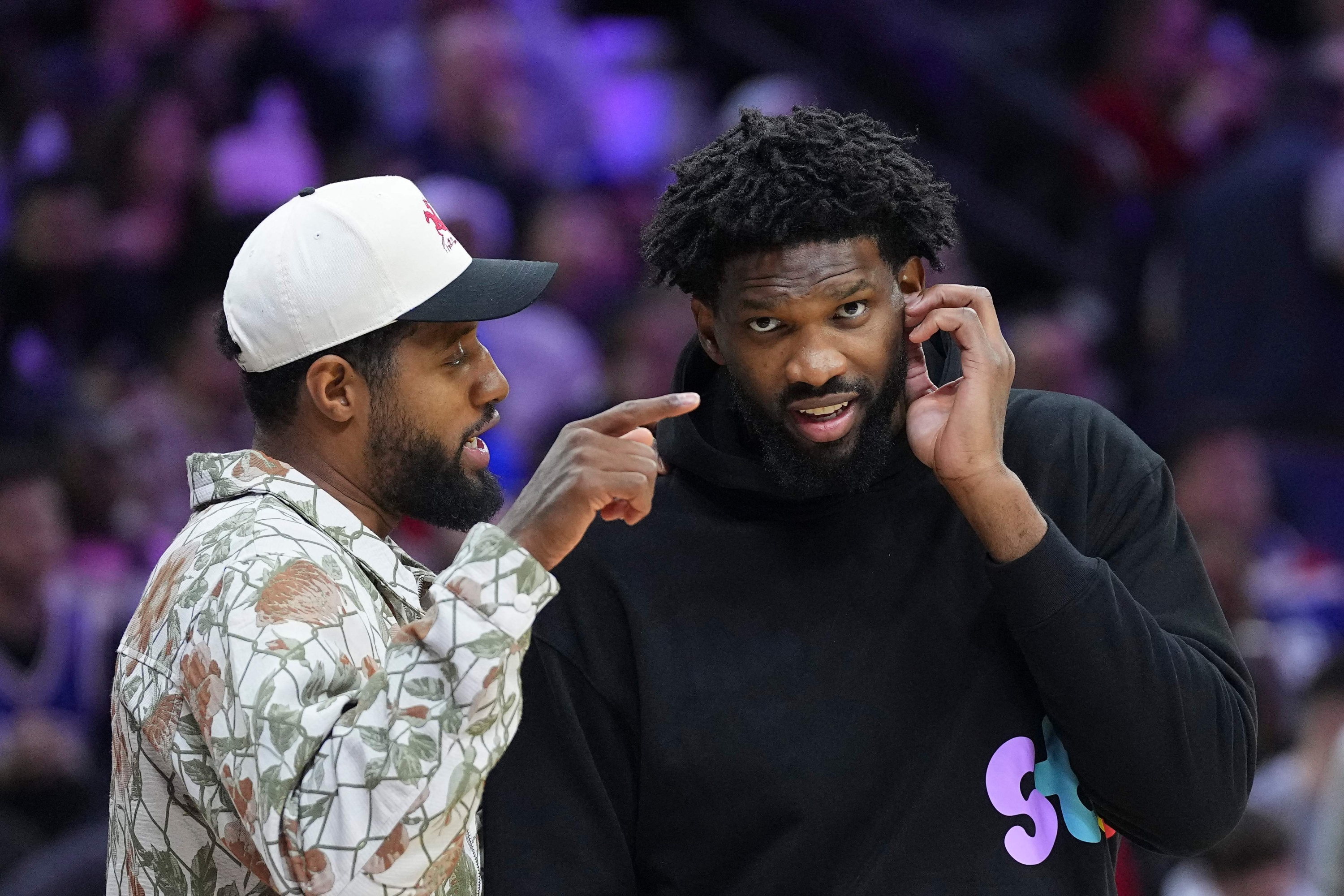 PHILADELPHIA, PENNSYLVANIA - NOVEMBER 2: Paul George #8 of the Philadelphia 76ers talks to Joel Embiid #21 during a timeout in the game against the Memphis Grizzlies in the first half at the Wells Fargo Center on November 2, 2024 in Philadelphia, Pennsylvania. NOTE TO USER: User expressly acknowledges and agrees that, by downloading and/or using this photograph, user is consenting to the terms and conditions of the Getty Images License Agreement.   Mitchell Leff/Getty Images/AFP (Photo by Mitchell Leff / GETTY IMAGES NORTH AMERICA / Getty Images via AFP)