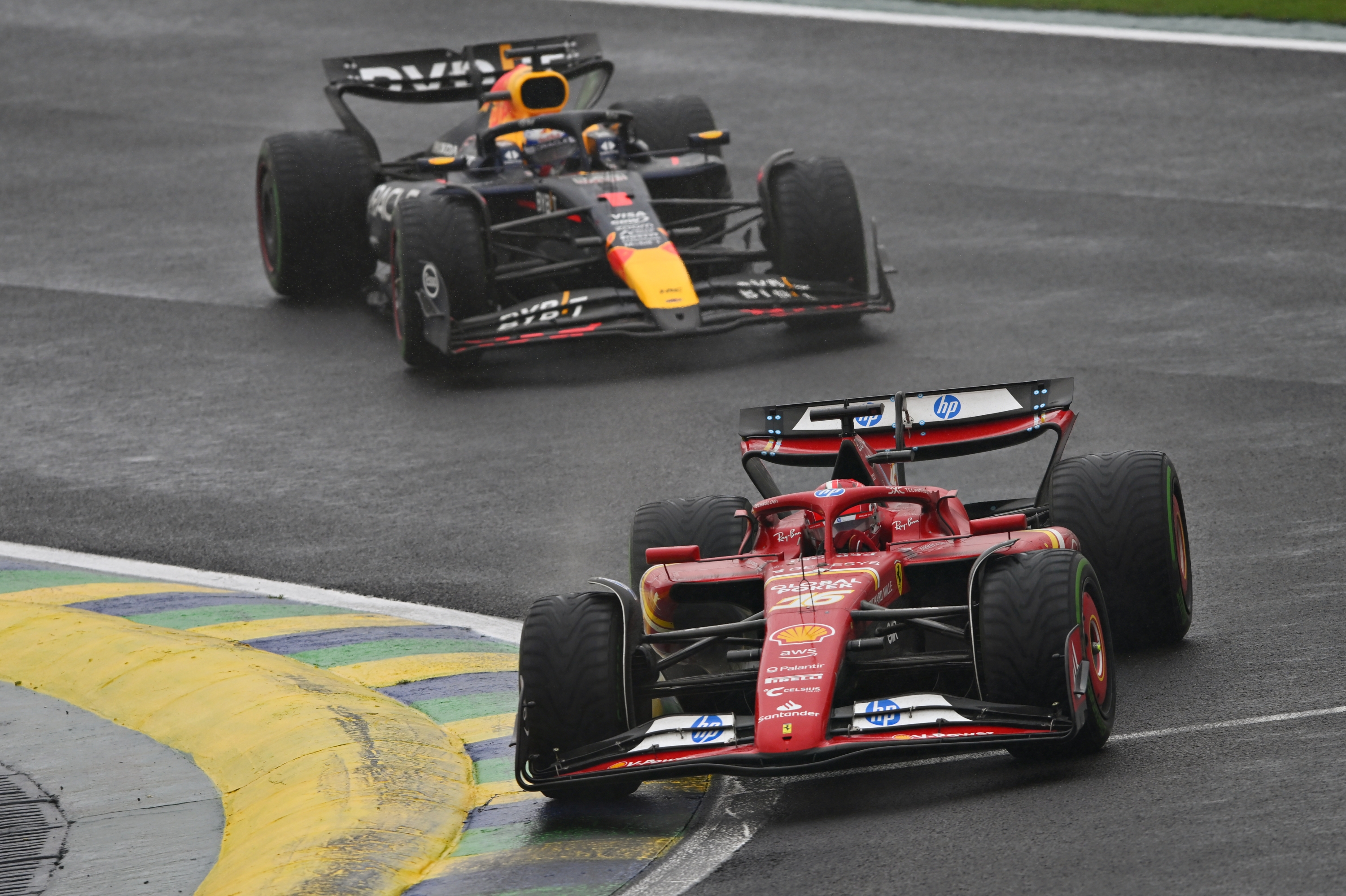 SAO PAULO, BRAZIL - NOVEMBER 03: Charles Leclerc of Monaco driving the (16) Ferrari SF-24 leads Max Verstappen of the Netherlands driving the (1) Oracle Red Bull Racing RB20 on track during the F1 Grand Prix of Brazil at Autodromo Jose Carlos Pace on November 03, 2024 in Sao Paulo, Brazil. (Photo by Rudy Carezzevoli/Getty Images)