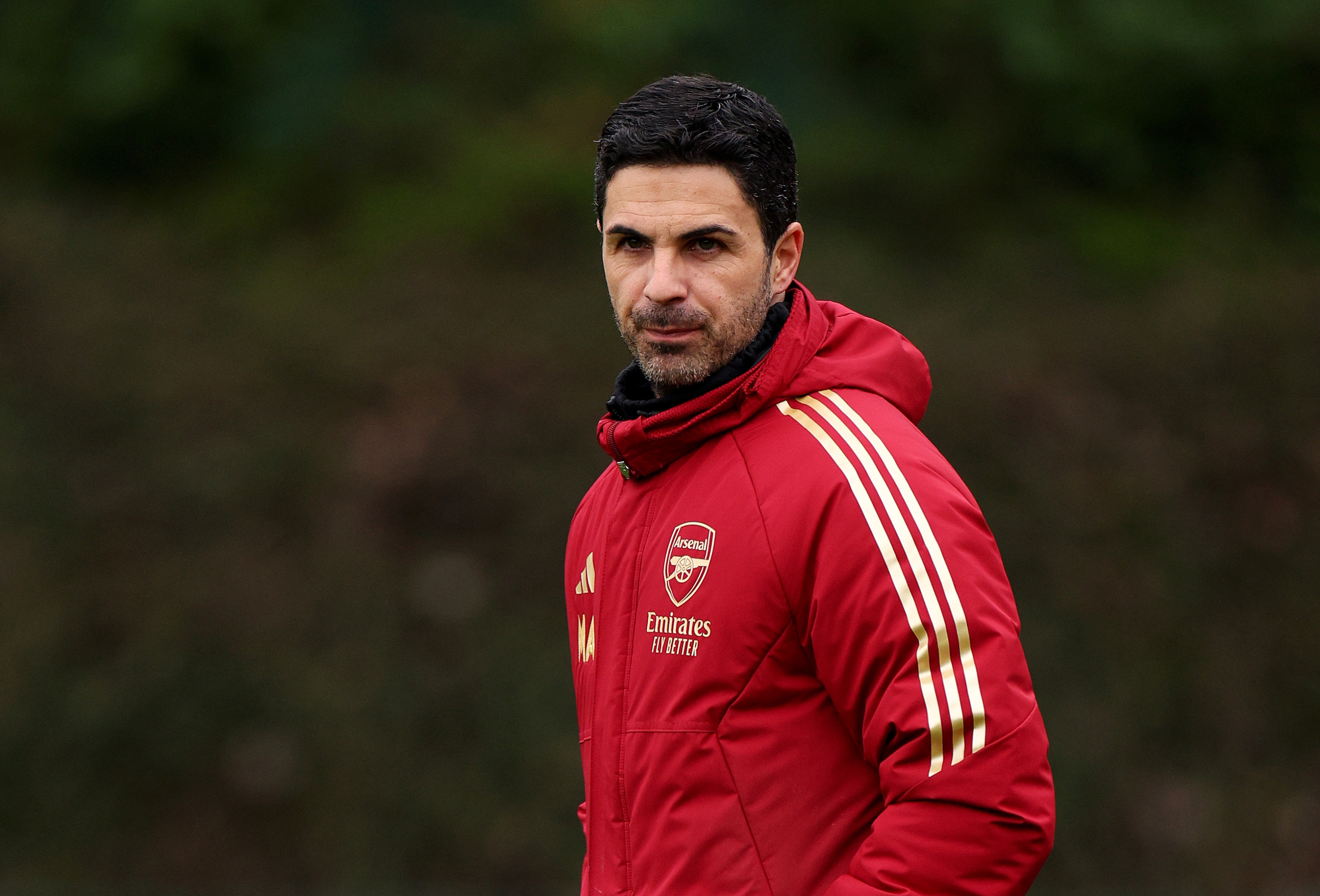 LONDON COLNEY, ENGLAND - MARCH 11: Mikel Arteta, Manager of Arsenal, looks on as he walks onto the pitch prior to the Arsenal FC Training Session And Press Conference at Sobha Realty Training Centre on March 11, 2024 in London Colney, England. (Photo by Andrew Redington/Getty Images)