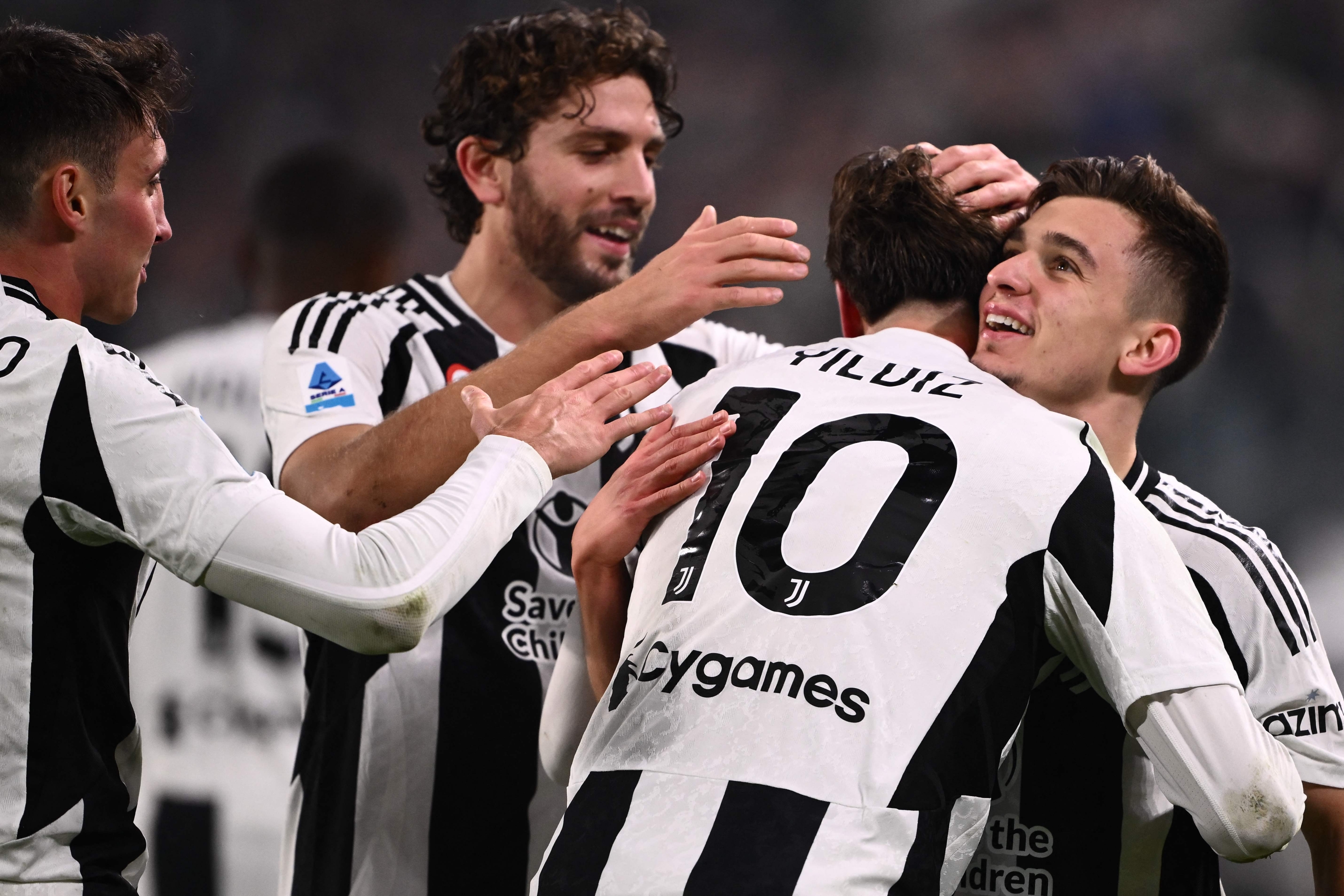 Juventus Turkish forward #10 Kenan Yildiz celebrates with Juventus Portuguese forward #07 Francisco Conceicao after scoring a goal during the Italian Serie A football match between Juventus and Torino at the "Allianz Stadium" in Turin, on November 9, 2024. (Photo by MARCO BERTORELLO / AFP)