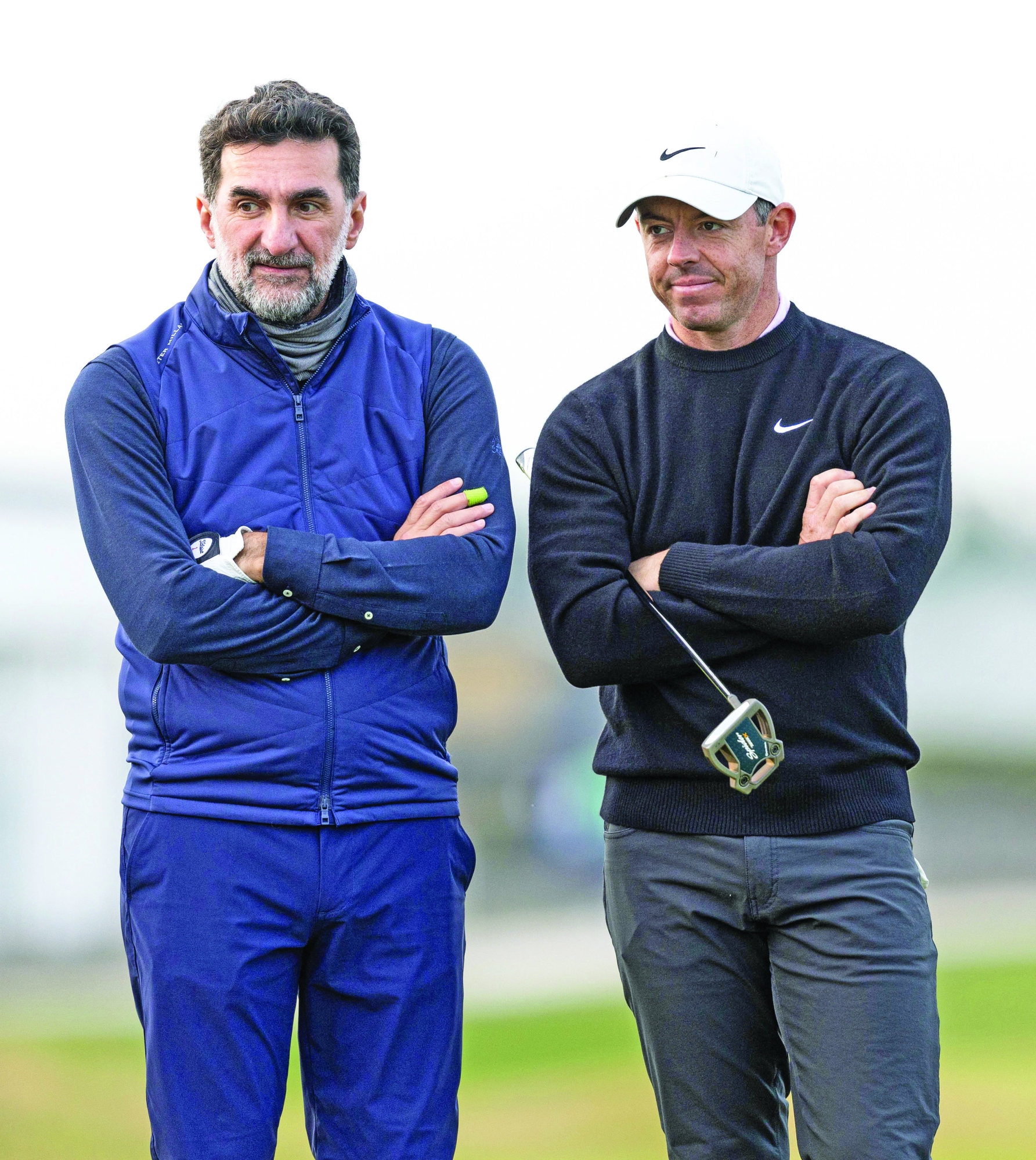 ST ANDREWS, SCOTLAND - OCTOBER 05: Yasir Al-Rumayyan, Governor of Saudi Arabia's Public Investment Fund and LIV Golf Chairman and Rory McIlroy of Northern Ireland during the 2024 Alfred Dunhill Links Championship Third Round at the Old Course, on October 05, 2024, in St Andrews, Scotland. (Photo by Ross Parker/SNS Group via Getty Images)