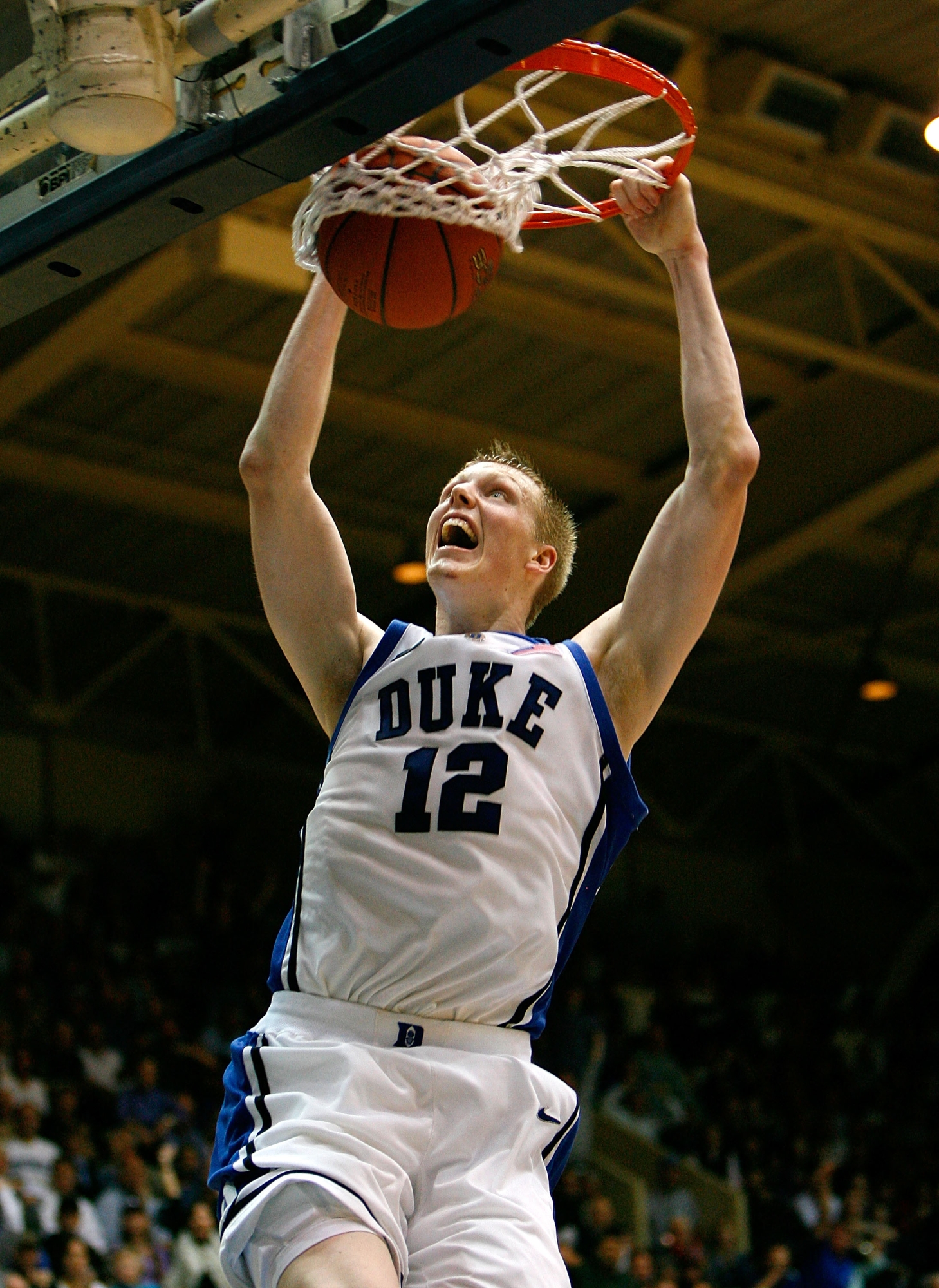 DURHAM, NC - FEBRUARY 13:  Kyle Singler #12 of the Duke Blue Devils dunks against the Maryland Terrapins during the second half at Cameron Indoor Stadium on February 13, 2008 in Durham, North Carolina.  Duke defeated Maryland 77-65.  (Photo by Kevin C. Cox/Getty Images) (Photo by Kevin C. Cox / Getty Images North America / Getty Images via AFP)