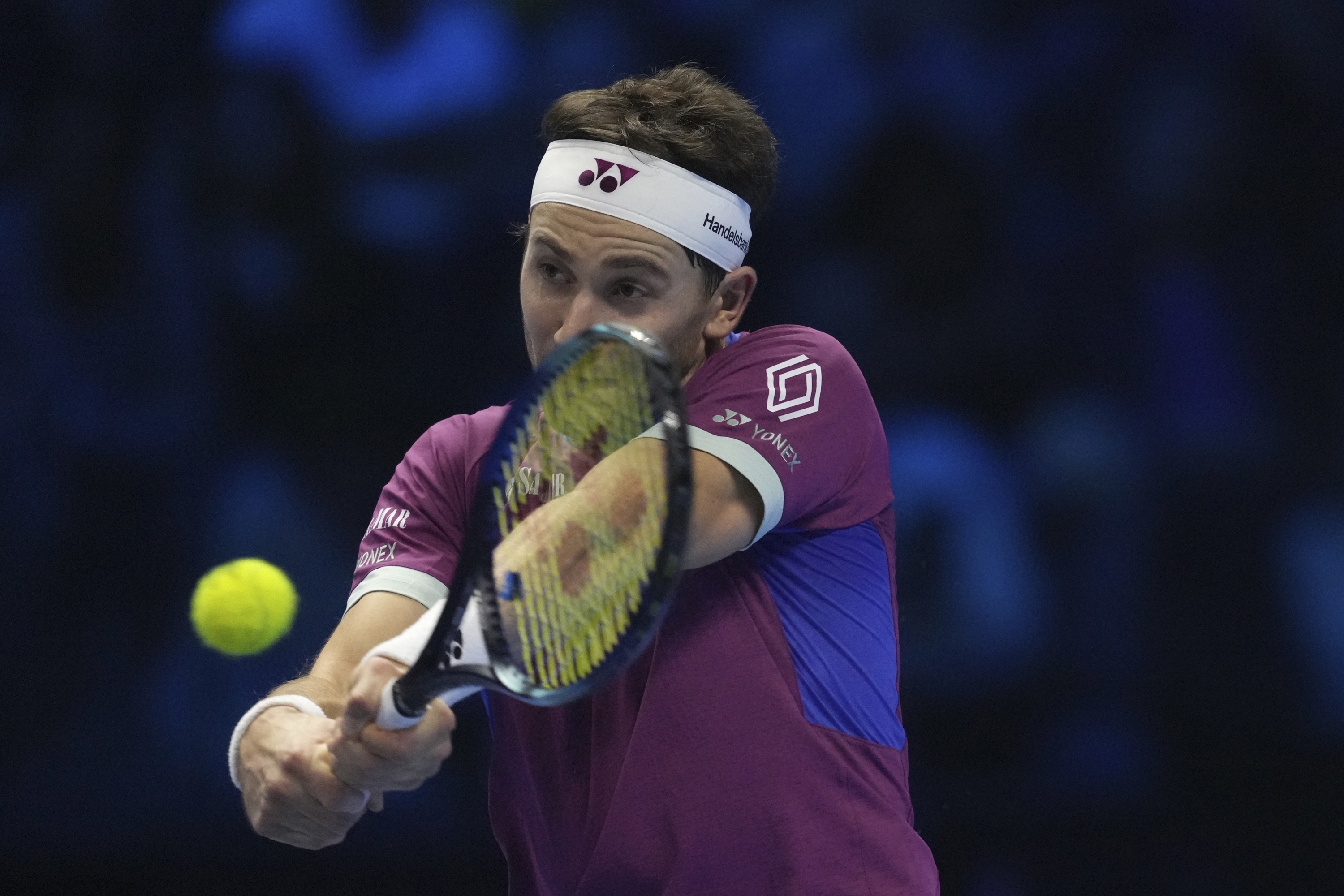 Norway's Casper Ruud returns the ball to Germany's Alexander Zverev during their singles tennis match of the ATP World Tour Finals at the Inalpi Arena, in Turin, Italy, Wednesday, Nov. 13, 2024. (AP Photo/Antonio Calanni)