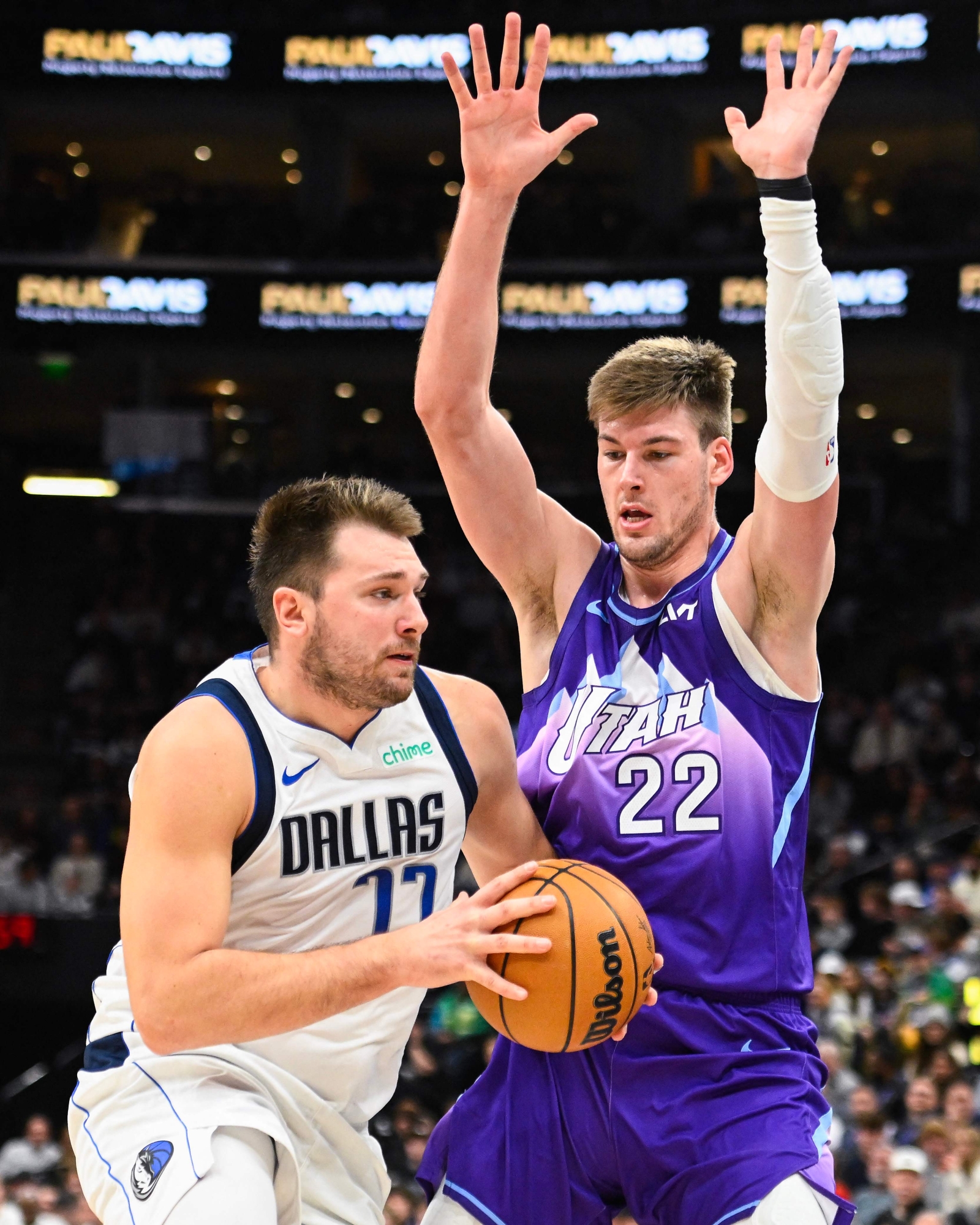 SALT LAKE CITY, UTAH - NOVEMBER 14: Luka Doncic #77 of the Dallas Mavericks drives into Kyle Filipowski #22 of the Utah Jazz during the first half of a game at Delta Center on November 14, 2024 in Salt Lake City, Utah. NOTE TO USER: User expressly acknowledges and agrees that, by downloading and or using this photograph, User is consenting to the terms and conditions of the Getty Images License Agreement.   Alex Goodlett/Getty Images/AFP (Photo by Alex Goodlett / GETTY IMAGES NORTH AMERICA / Getty Images via AFP)