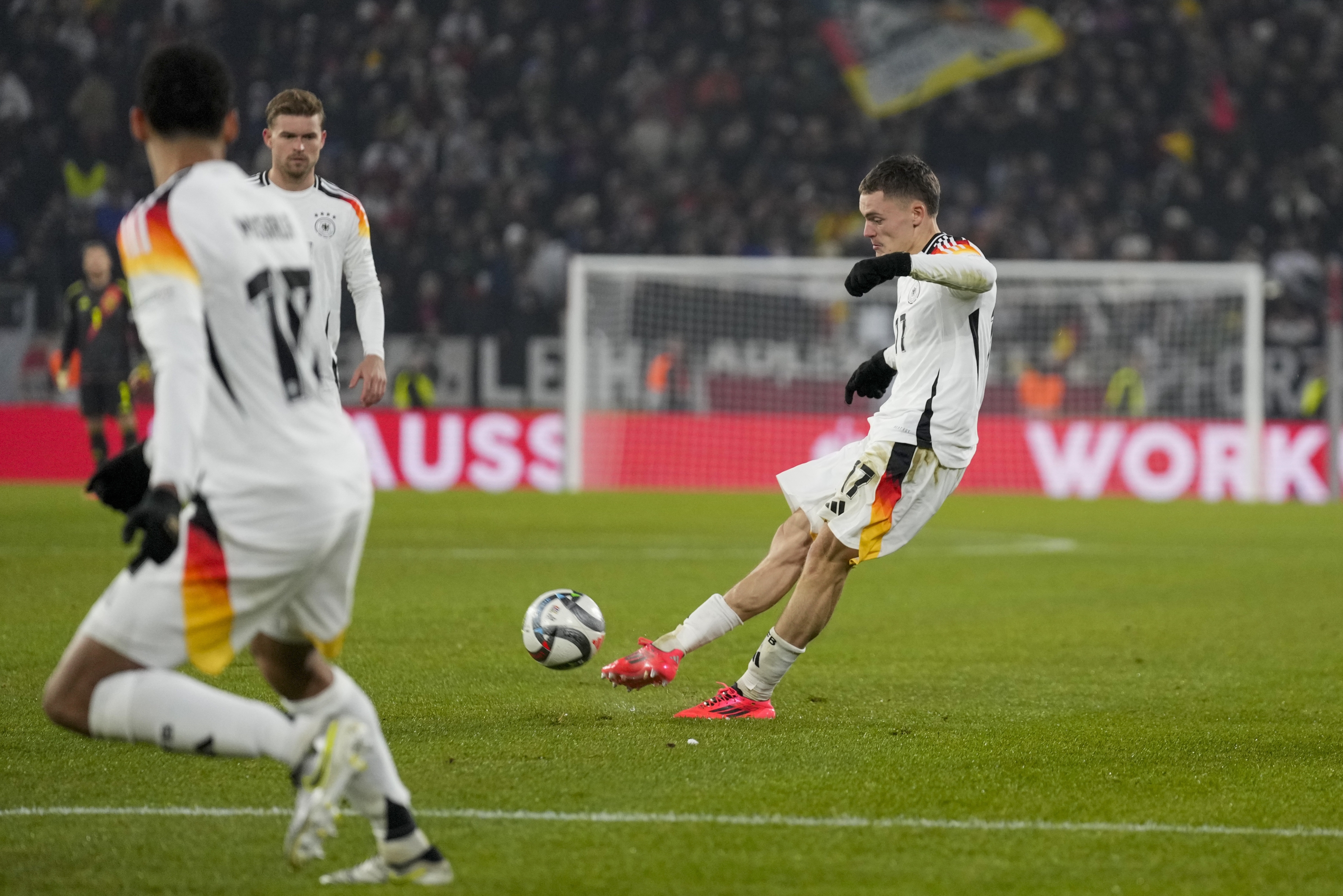 Germany's Florian Wirtz scores his side's fourth goal during the Nations League group soccer match between Germany and Bosnia in Freiburg, Germany, Saturday, Nov. 16, 2024. (AP Photo/Michael Probst)