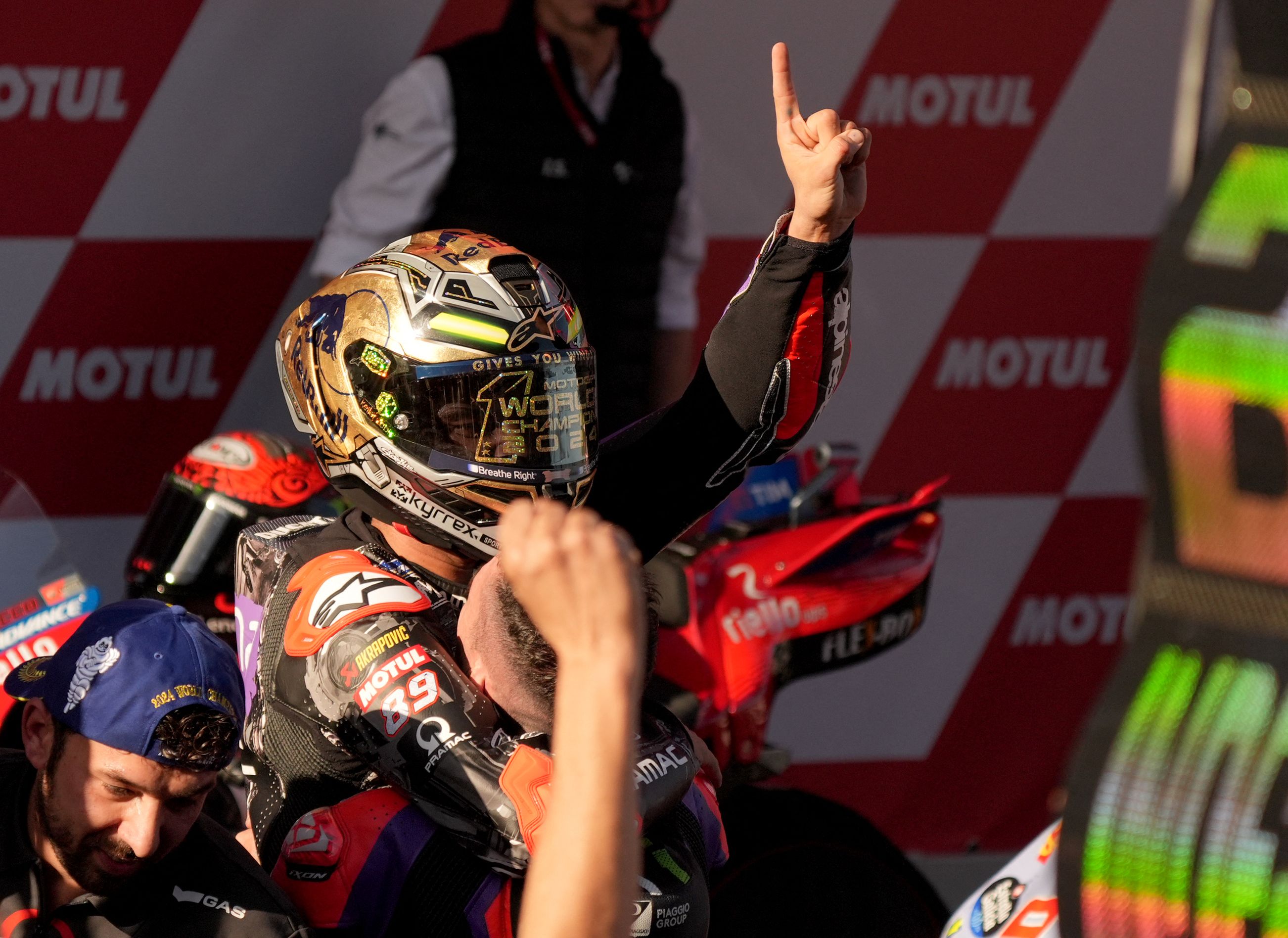 Ducati Spanish rider Jorge Martin celebrates becoming the new world champion after the MotoGP Solidarity Grand Prix of Barcelona at the Circuit de Catalunya on November 17, 2024 in Montmelo on the outskirts of Barcelona. Jorge Martin won the MotoGP world title after taking a 24-point lead into the final weekend of the season in Barcelona. (Photo by Manaure Quintero / AFP)