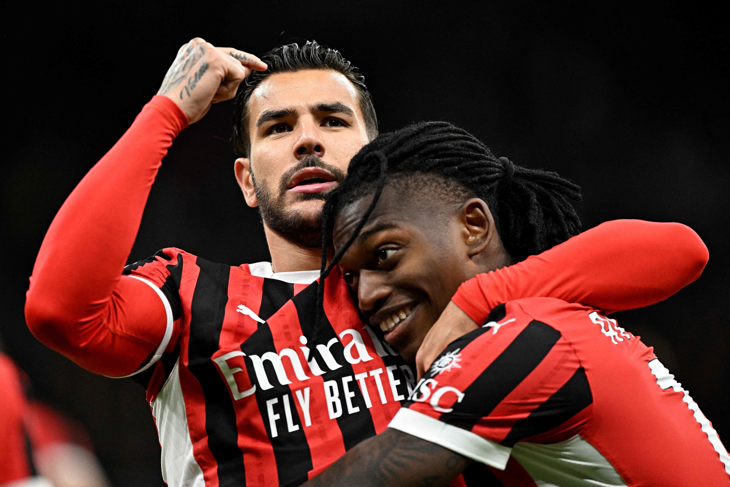 AC Milan's French defender #19 Theo Hernandez celebrates with AC Milan's Portuguese forward #10 Rafael Leao (R) after scoring the opening goal during the Italian Serie A football match between AC Milan and Venezia FC at the San Siro Stadium in Milan, on September 14, 2024.  (Photo by Gabriel BOUYS / AFP)