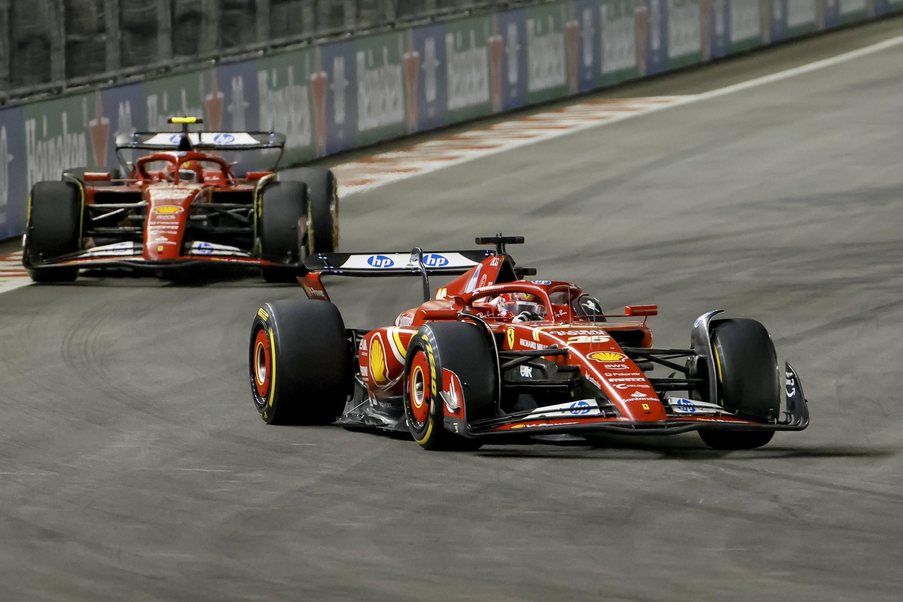 epa11737597 Scuderia Ferrari driver Charles Leclerc (R) of Monaco and Scuderia Ferrari driver Carlos Sainz Jr. (L) of Spain in action during the Formula One Las Vegas Grand Prix at the Las Vegas Strip Circuit in Las Vegas, Nevada, USA, 23 November 2024.  EPA/SHAWN THEW