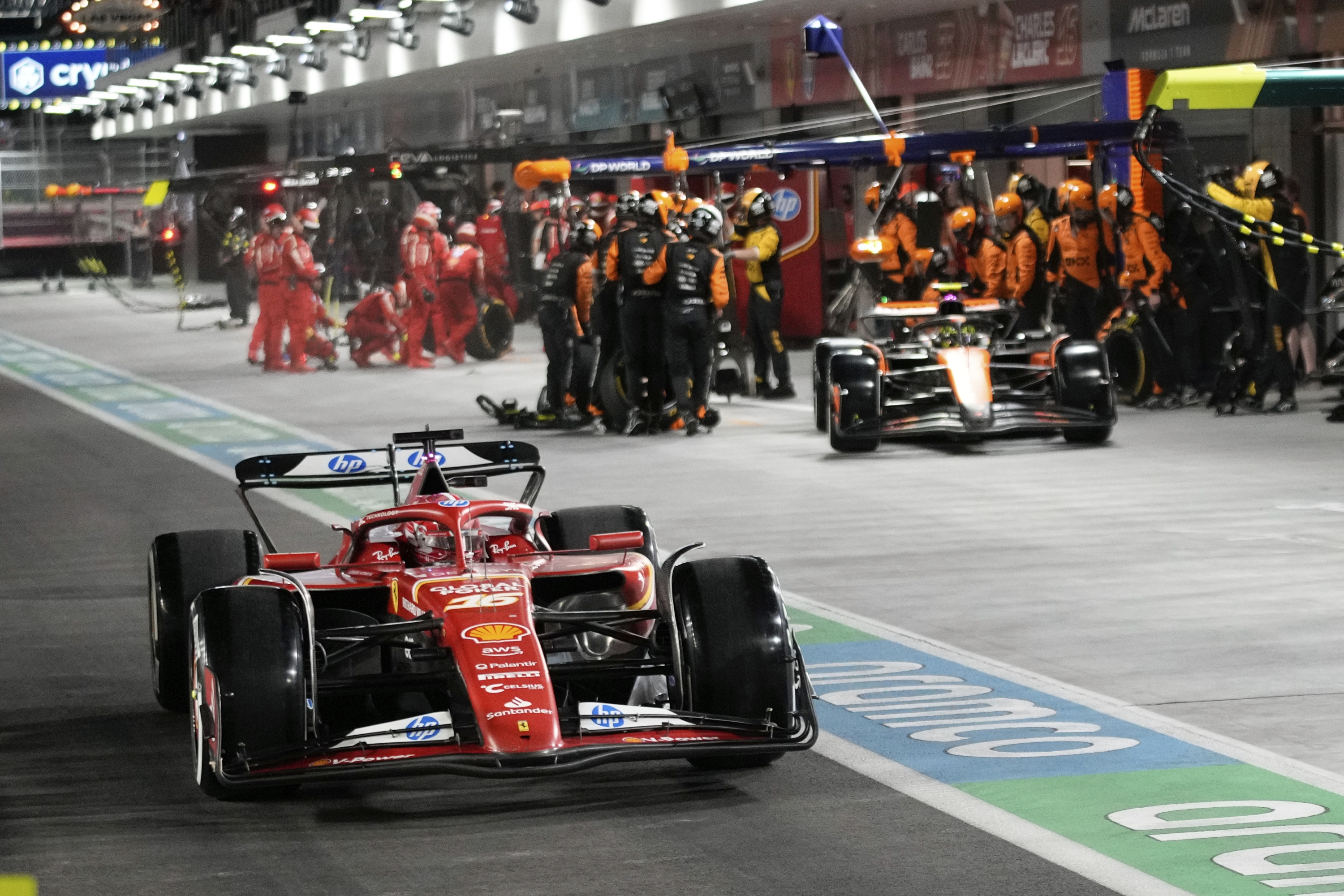 Ferrari driver Charles Leclerc, of Monaco, drives on pit row during the F1 Las Vegas Grand Prix auto race, Saturday, Nov. 23, 2024, in Las Vegas. (AP Photo/John Locher, Pool)