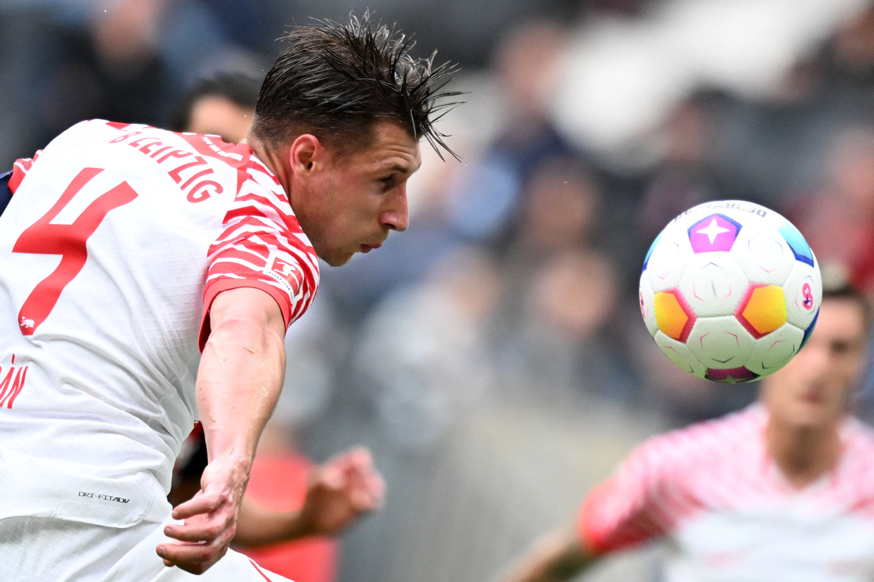 Leipzig's Hungarian defender #04 Willi Orban kicks a ball during the German first division Bundesliga football match between Eintracht Frankfurt and RB Leipzig in Frankfurt am Main, western Germany on May 18, 2024. (Photo by Kirill KUDRYAVTSEV / AFP) / DFL REGULATIONS PROHIBIT ANY USE OF PHOTOGRAPHS AS IMAGE SEQUENCES AND/OR QUASI-VIDEO