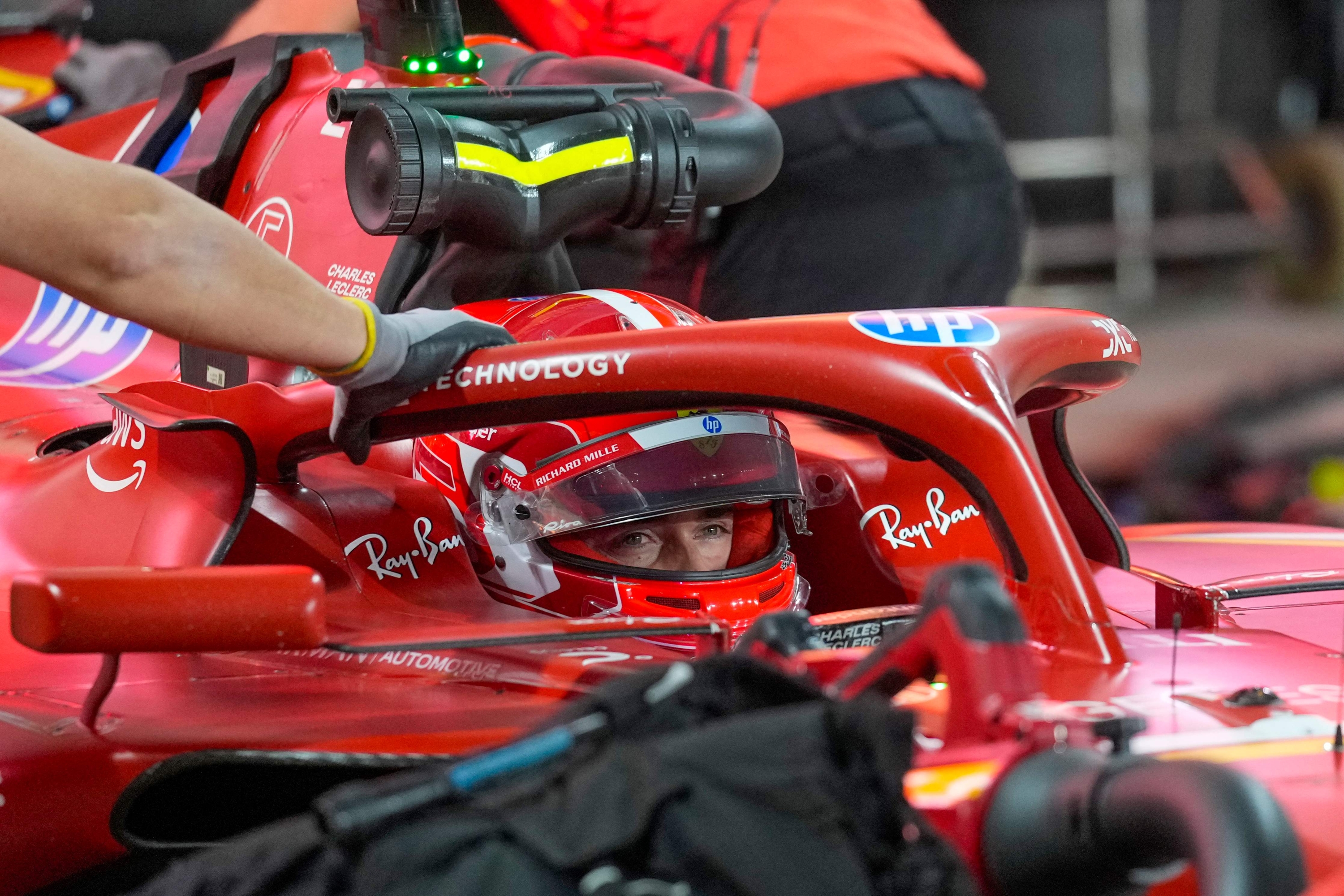 Ferrari's Monegasque driver Charles Leclerc returns to the garage during the qualifying session of the Qatari Formula One Grand Prix at Lusail International Circuit in Lusail, north of Doha, on November 30, 2024. (Photo by Darko Bandic / POOL / AFP)