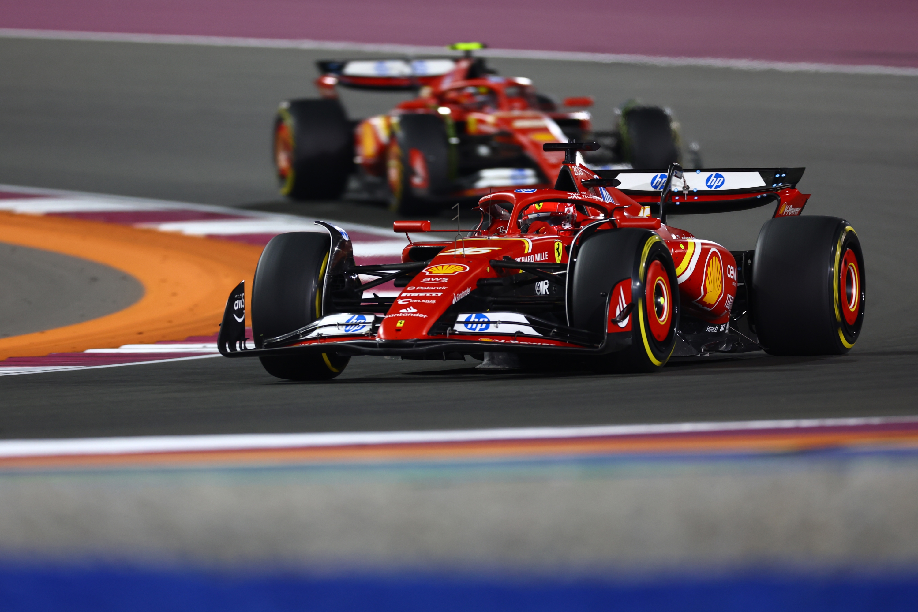 LUSAIL CITY, QATAR - DECEMBER 01: Charles Leclerc of Monaco driving the (16) Ferrari SF-24 leads Carlos Sainz of Spain driving (55) the Ferrari SF-24 on track during the F1 Grand Prix of Qatar at Lusail International Circuit on December 01, 2024 in Lusail City, Qatar. (Photo by Mark Thompson/Getty Images)