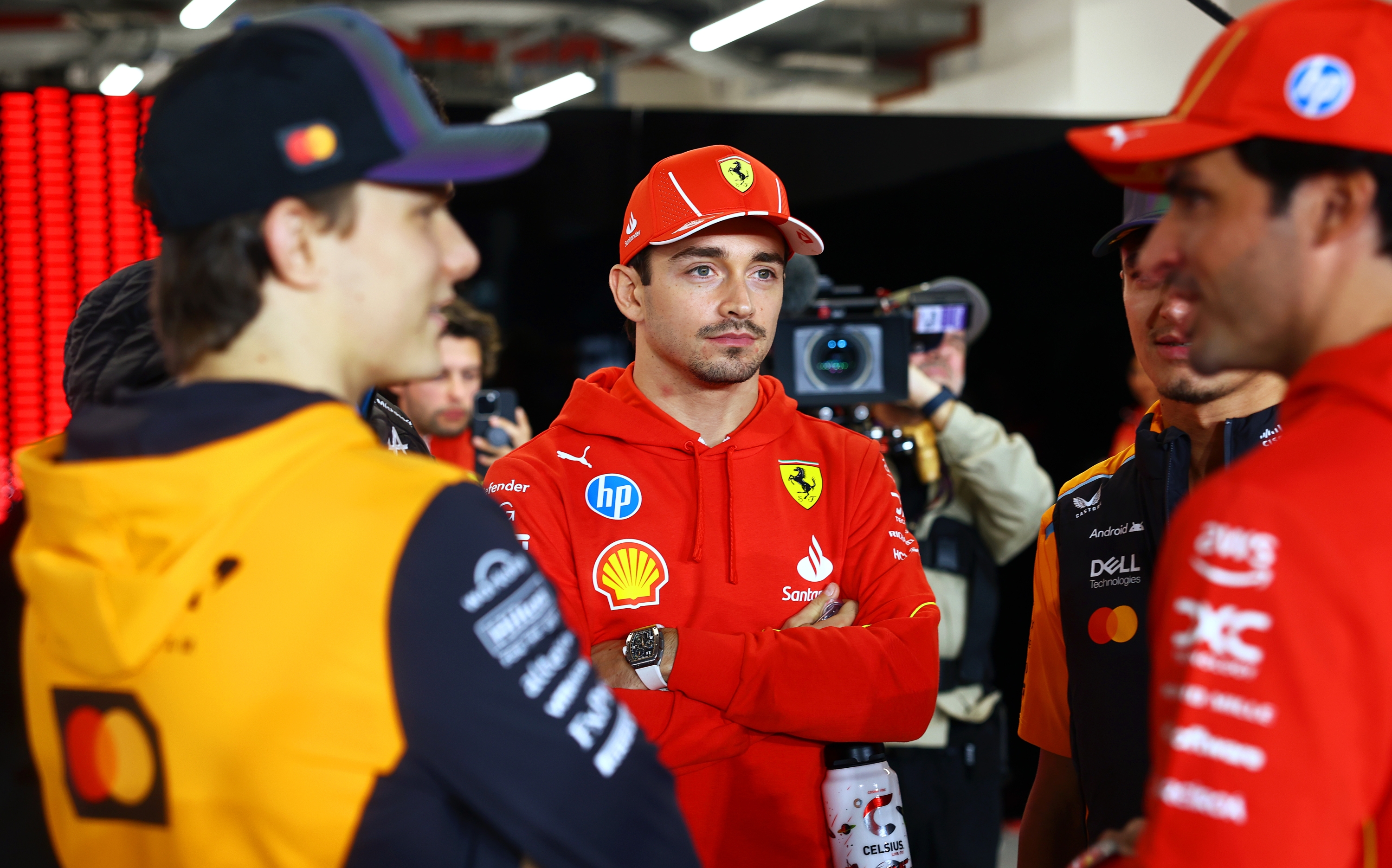 LUSAIL CITY, QATAR - DECEMBER 01: Charles Leclerc of Monaco and Ferrari looks on from the drivers parade prior to the F1 Grand Prix of Qatar at Lusail International Circuit on December 01, 2024 in Lusail City, Qatar. (Photo by Mark Thompson/Getty Images)